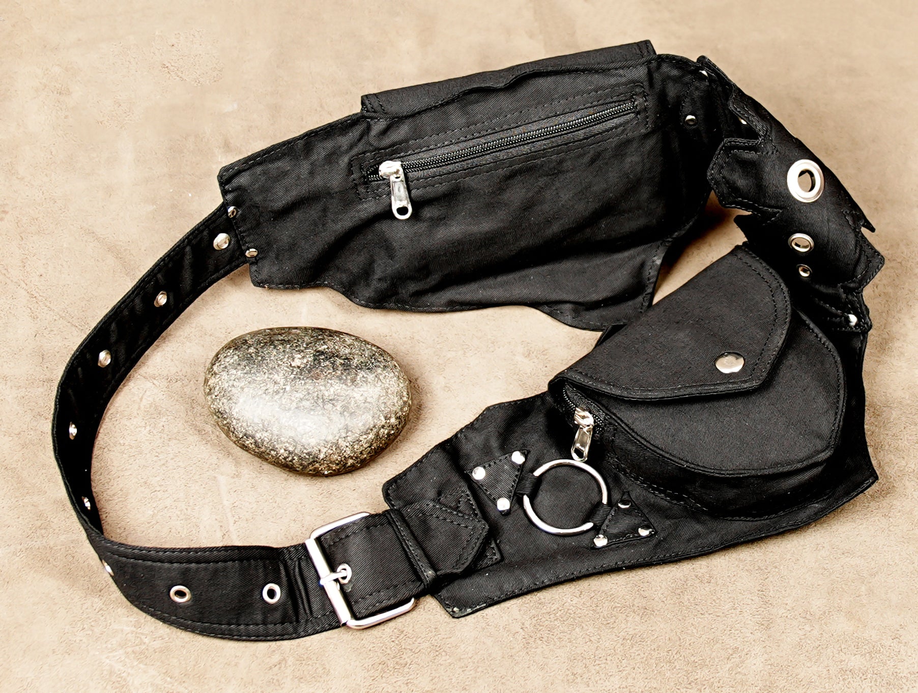 Gothic-style black canvas multi-pouch belt with metal O-rings and rivets.