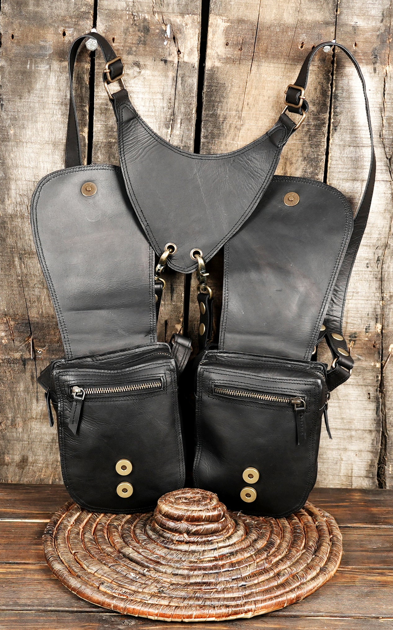 Black dual holster bag with reinforced stitching and rivets