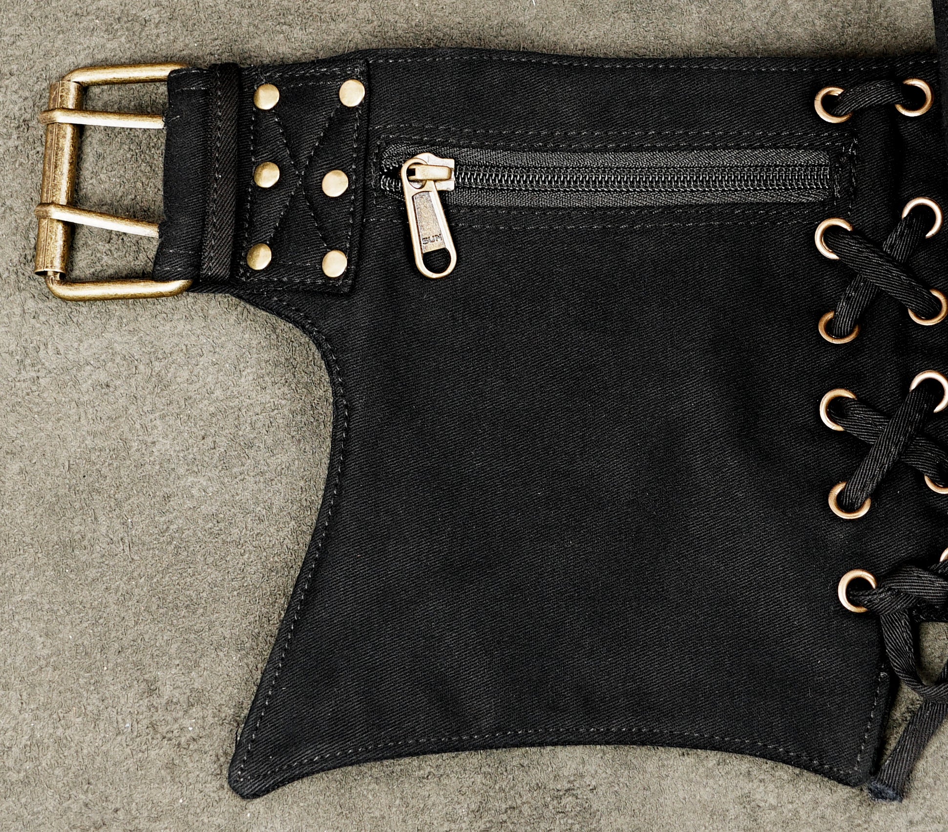 Black Burning Man utility belt with multiple pockets and adjustable fastening