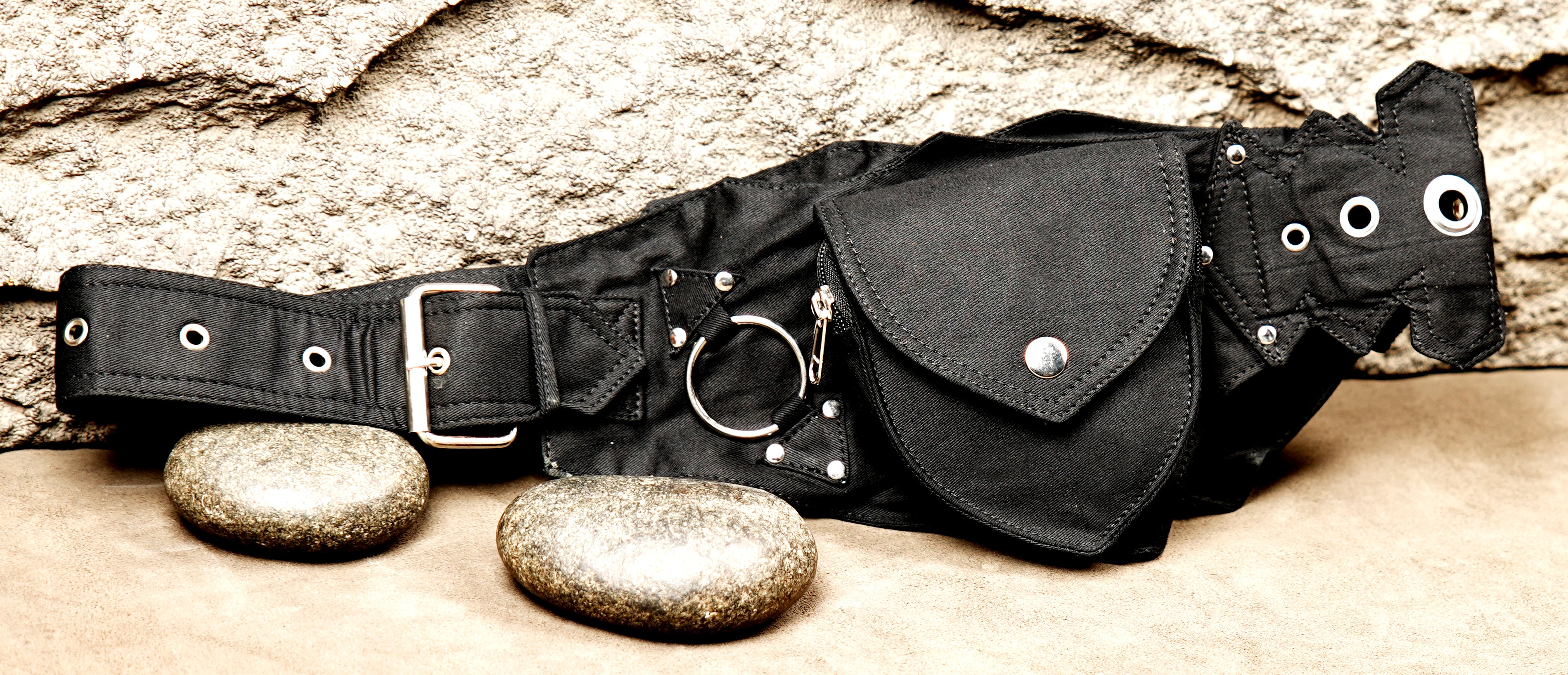 Rock and roll style black studded hip pouch belt with urban street fashion appeal.