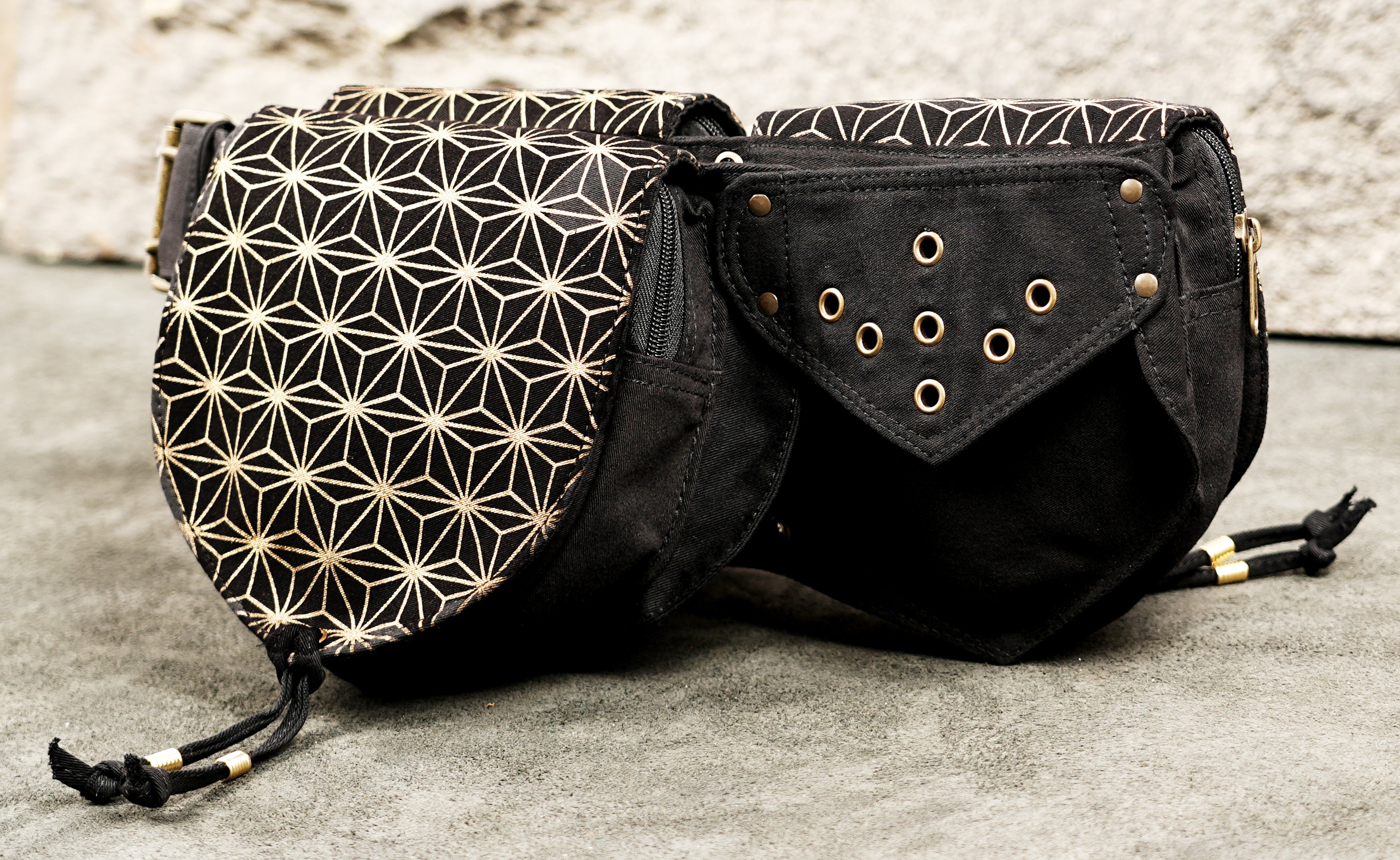 Close up of geometric star print pocket on black festival belt bag