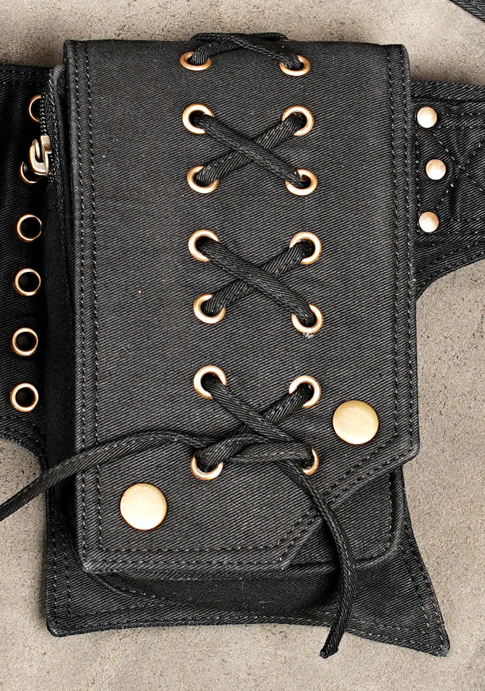 Travel bum bag in black fabric with secure zip and lace accents