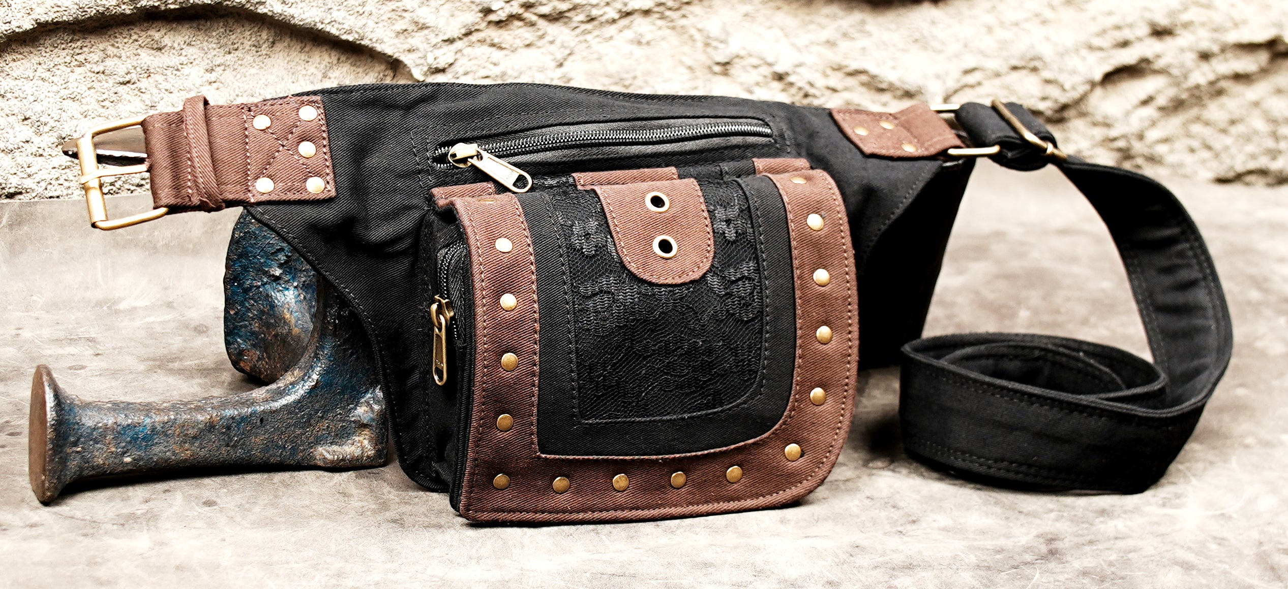 Two-tone waist bag with brass stud framing