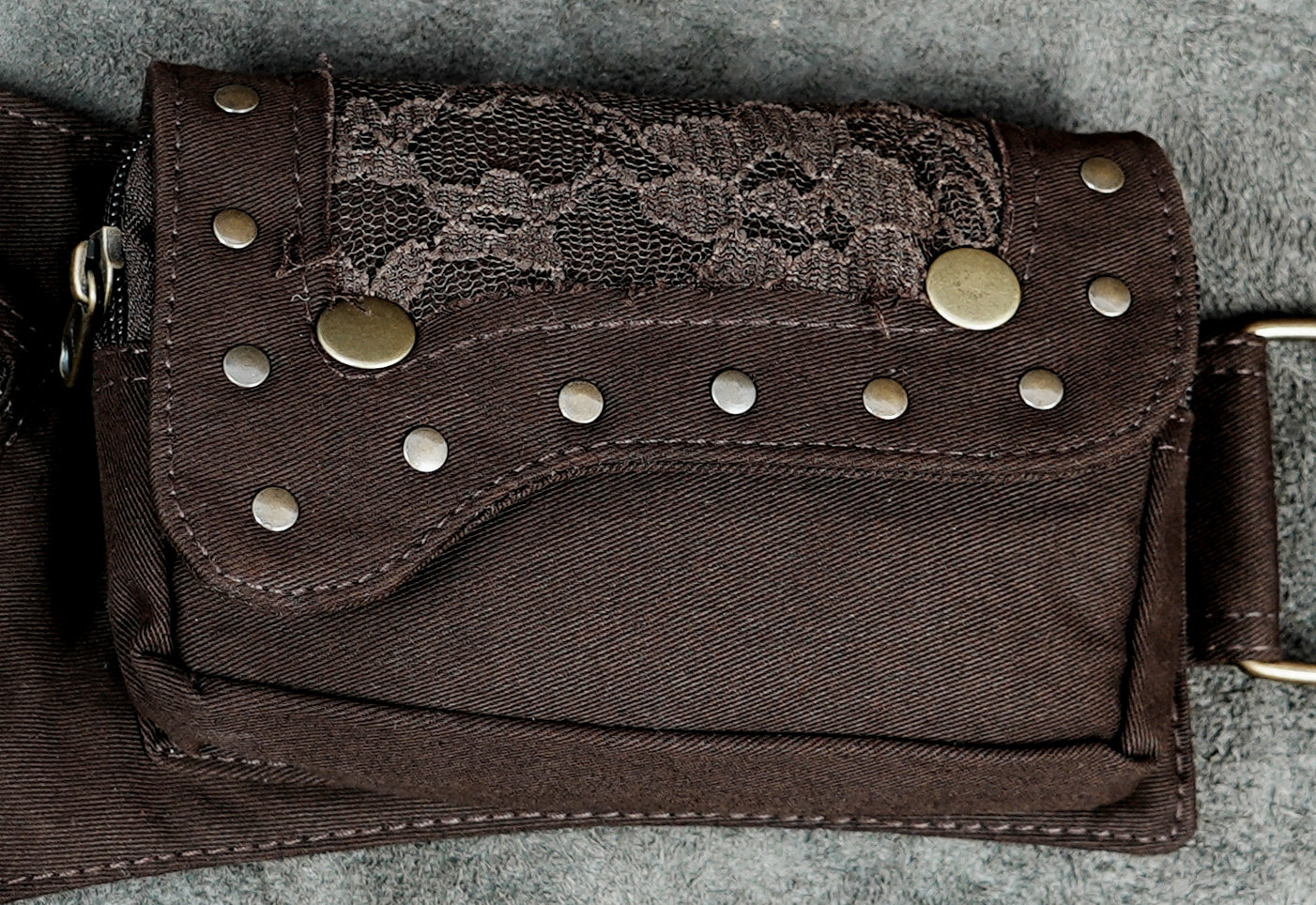 Brown gypsy style hip bag with lace flaps and stud trim