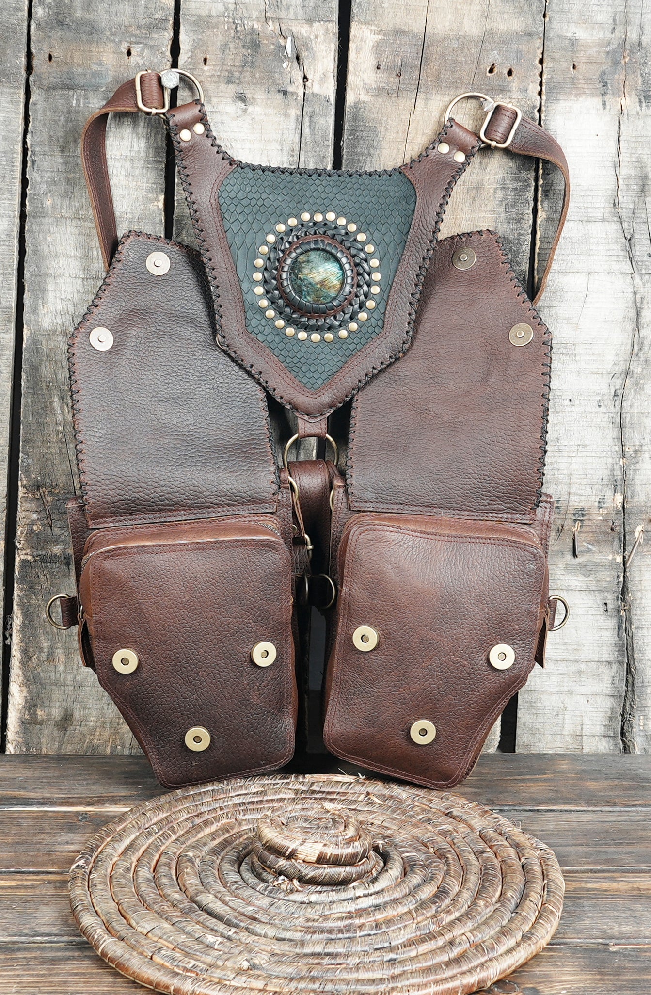 Decorative leather pouch holster with metal rivets