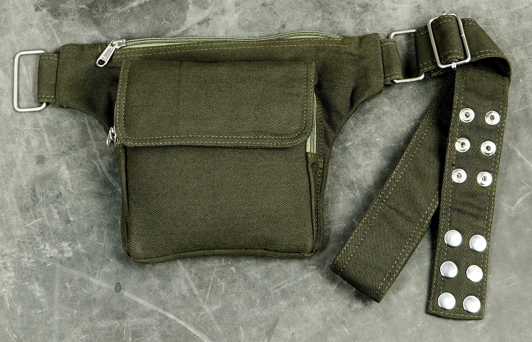 Olive green waist bag with multiple pockets for hiking and travel