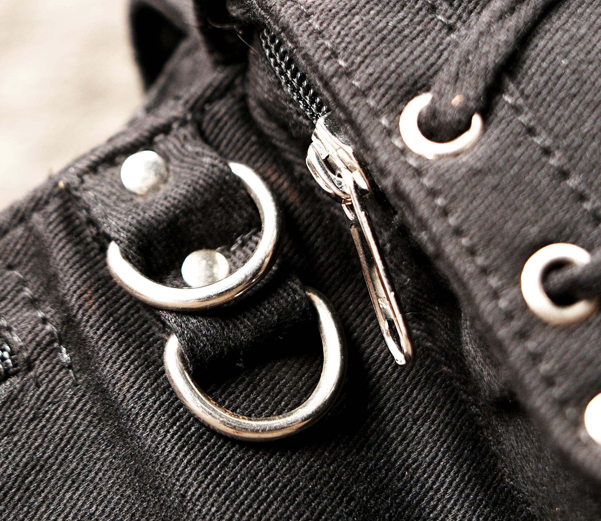 Multi-pocket waist bag made from strong, textured cotton fabric with reliable zipper and secure flap closures.