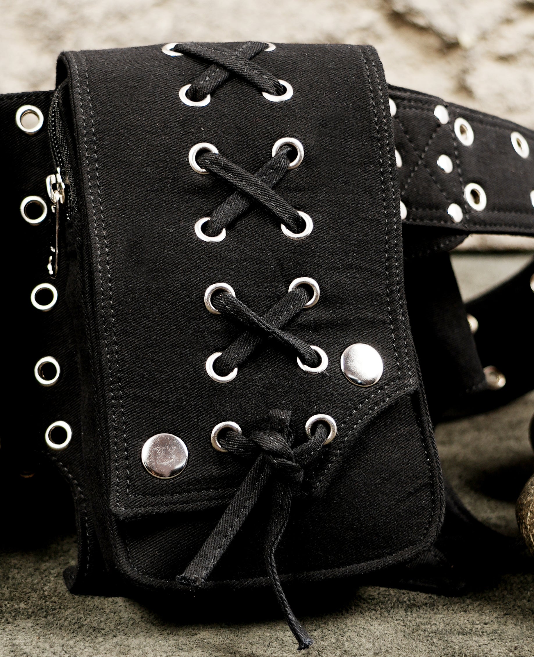 Black bat-wing shaped waist belt bag with lace-up pocket flaps