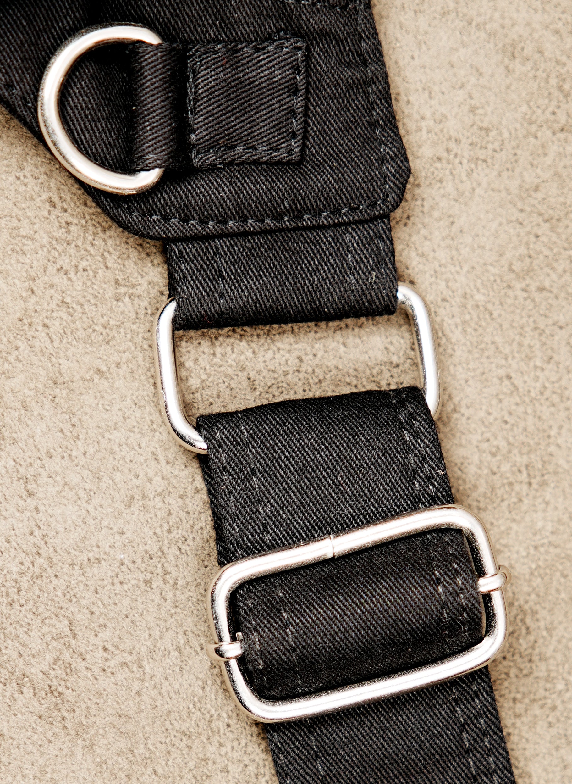 Unisex black canvas bum bag featuring metal buckles and decorative studs.