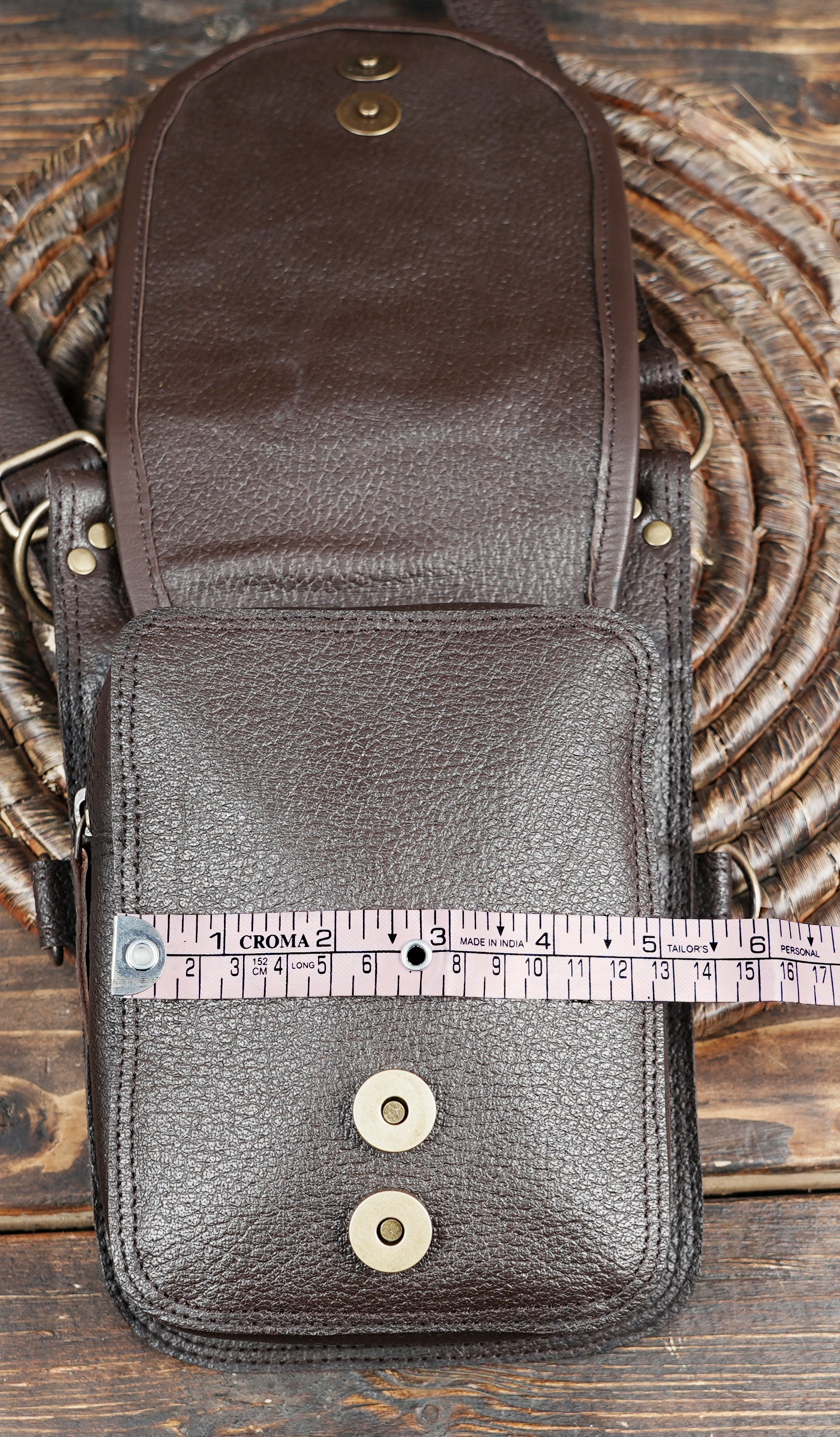 Brown leather hip and shoulder holster with steampunk hardware details