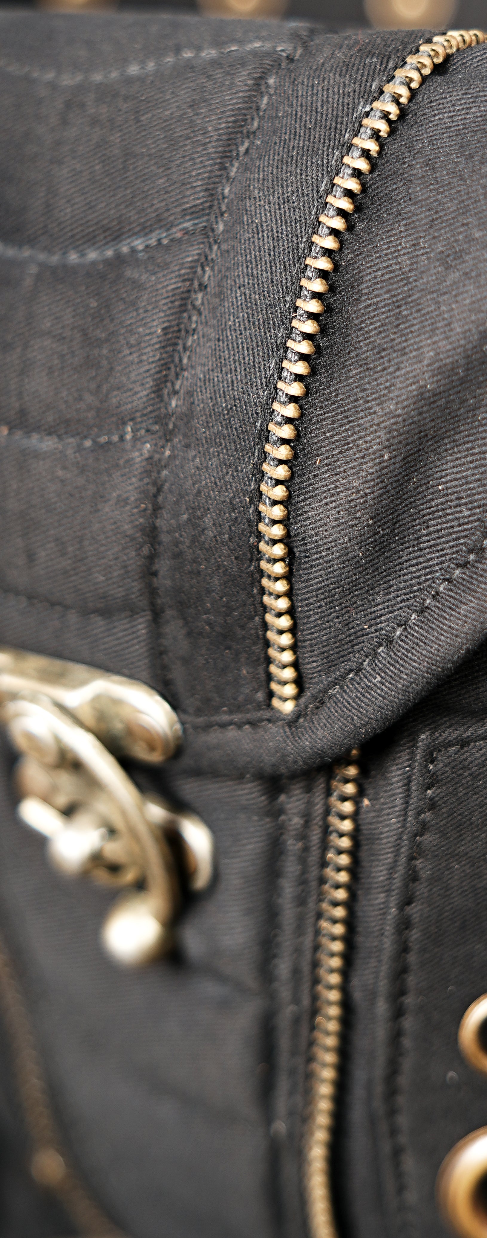 Tribal style canvas side thigh pack with front flap pocket and brass ring trims.