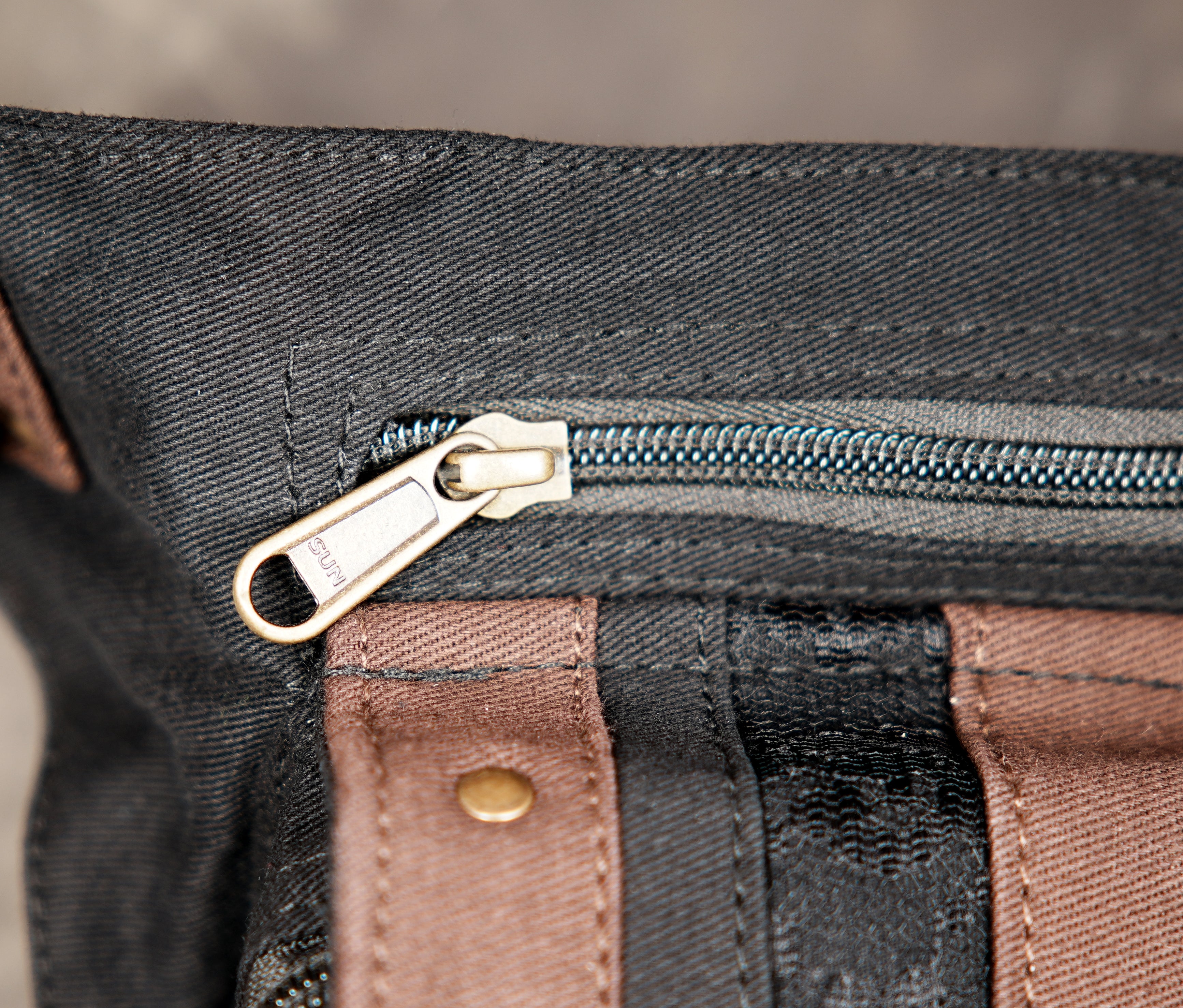 Cotton waist bag with brown leather trim and brass studs