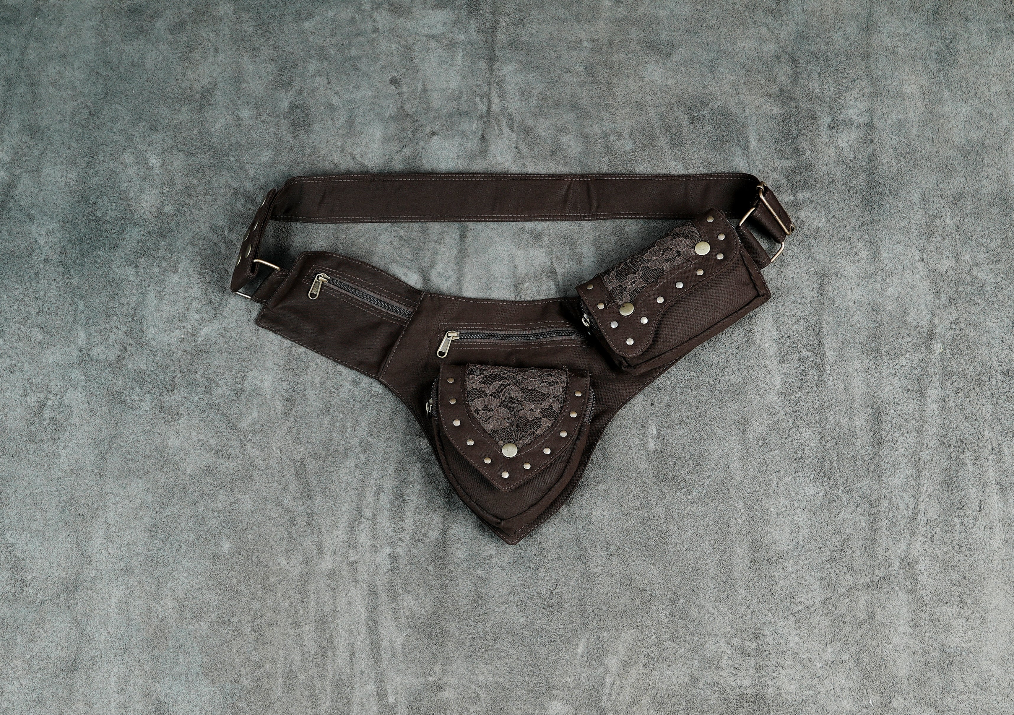 Brown cotton waist belt with multiple zip pockets and lace-trimmed flaps