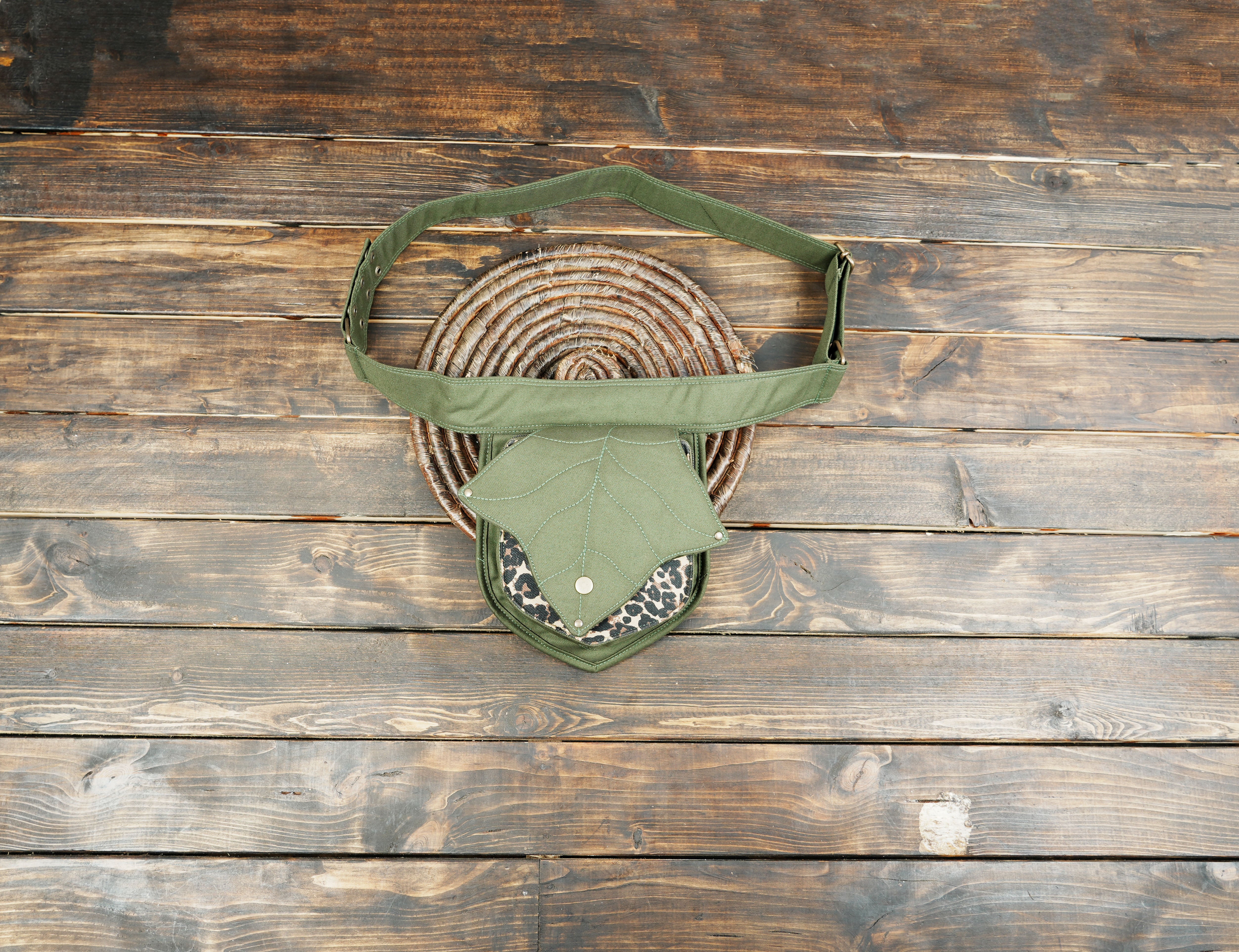 Stylish unisex festival fanny pack in dark green fabric with animal print accent