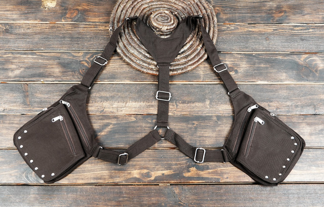 Industrial punk style shoulder bag with multiple zippers and silver studs