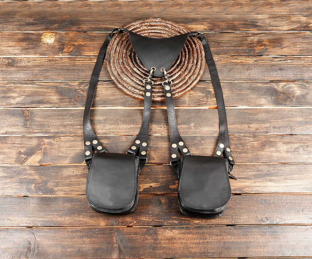 Black leather dual shoulder holster with simple flap pouches