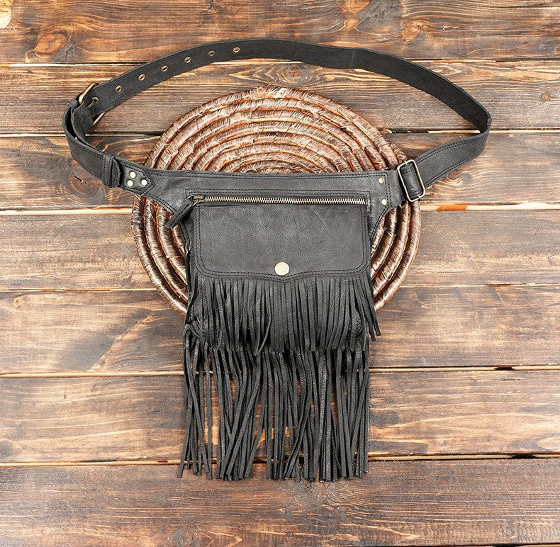 Handmade black leather waist belt bag with long fringe and zippered pocket.