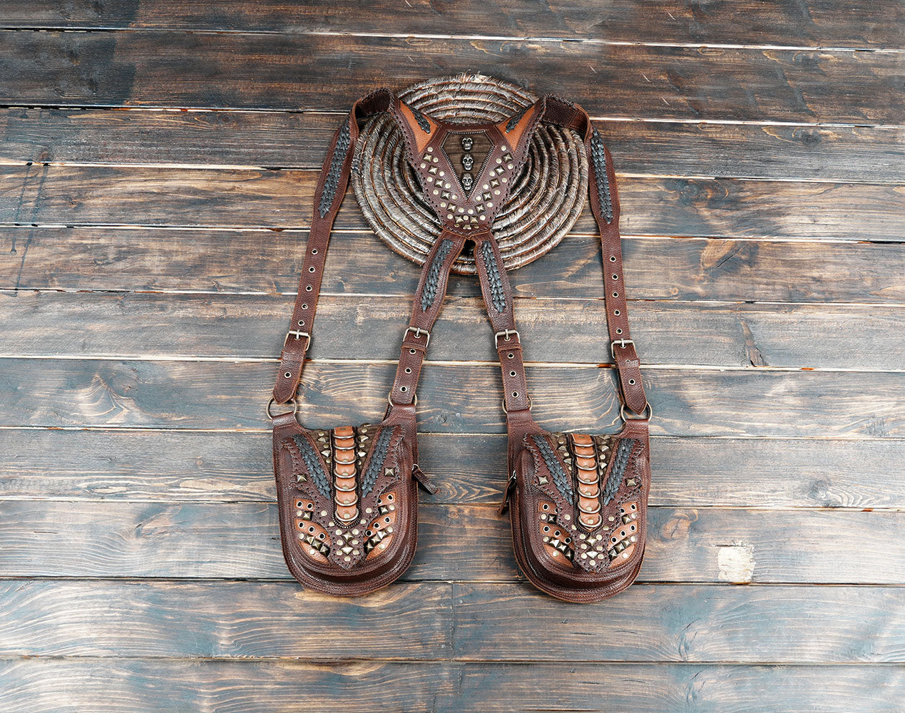 “Handmade leather holster harness with dual pouches and studded detailing”