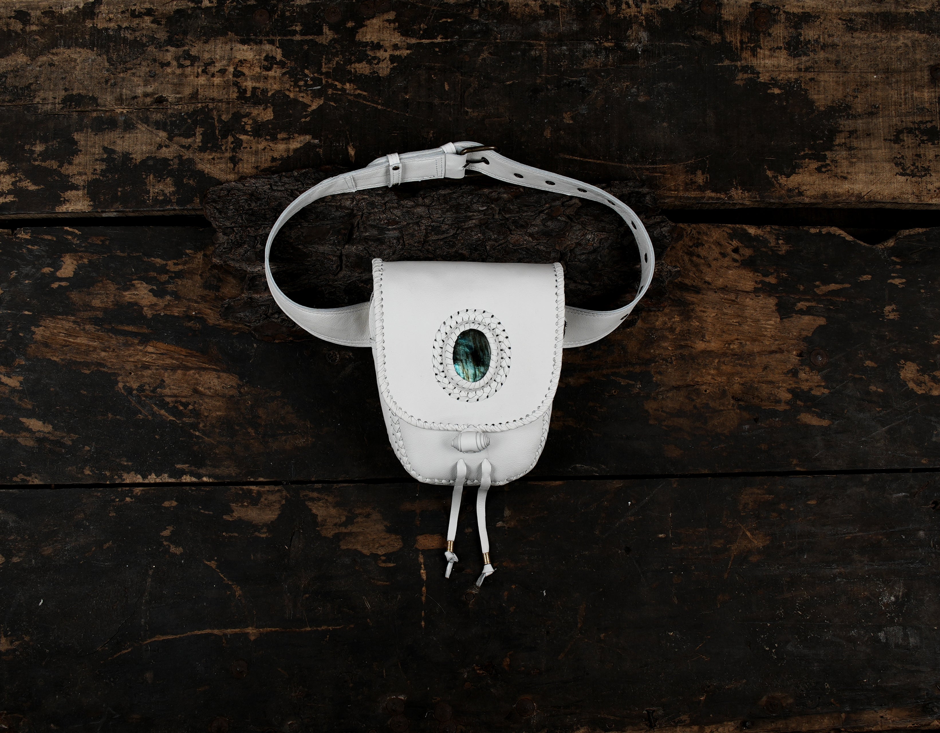 Genuine leather waist bag with gemstone inlay and braided trim