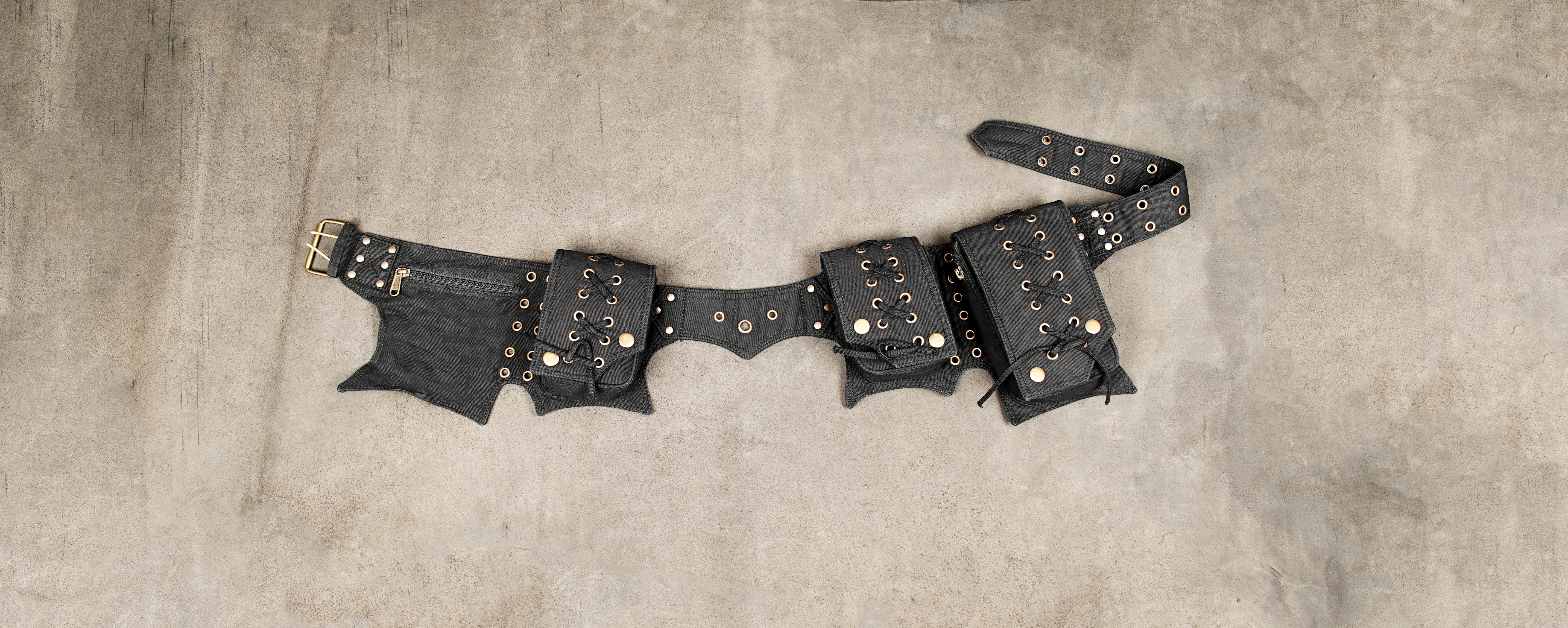 Black lace-up utility belt with multiple pouches and grommets