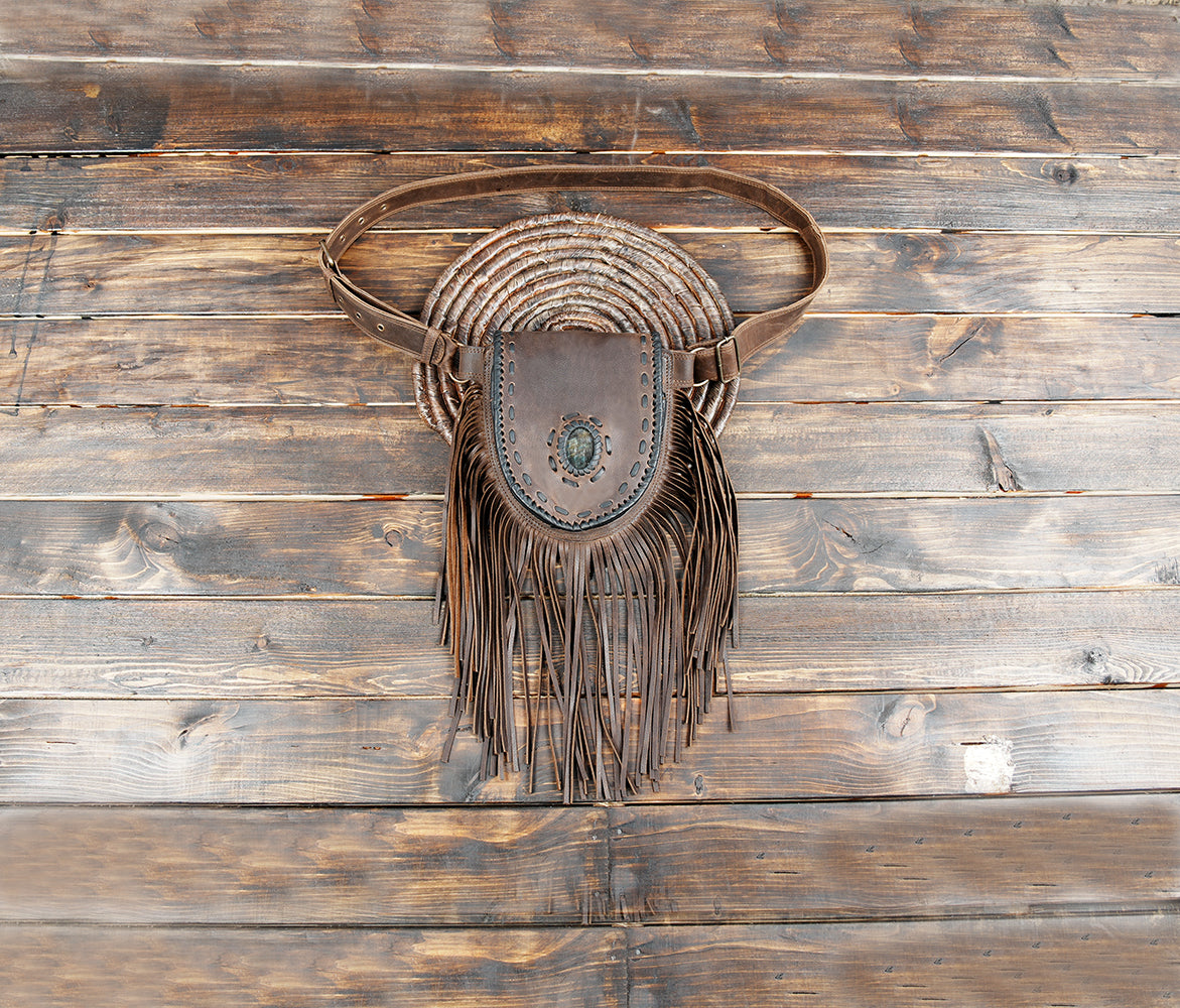 Western brown leather belt bag with fringe and gemstone centerpiece