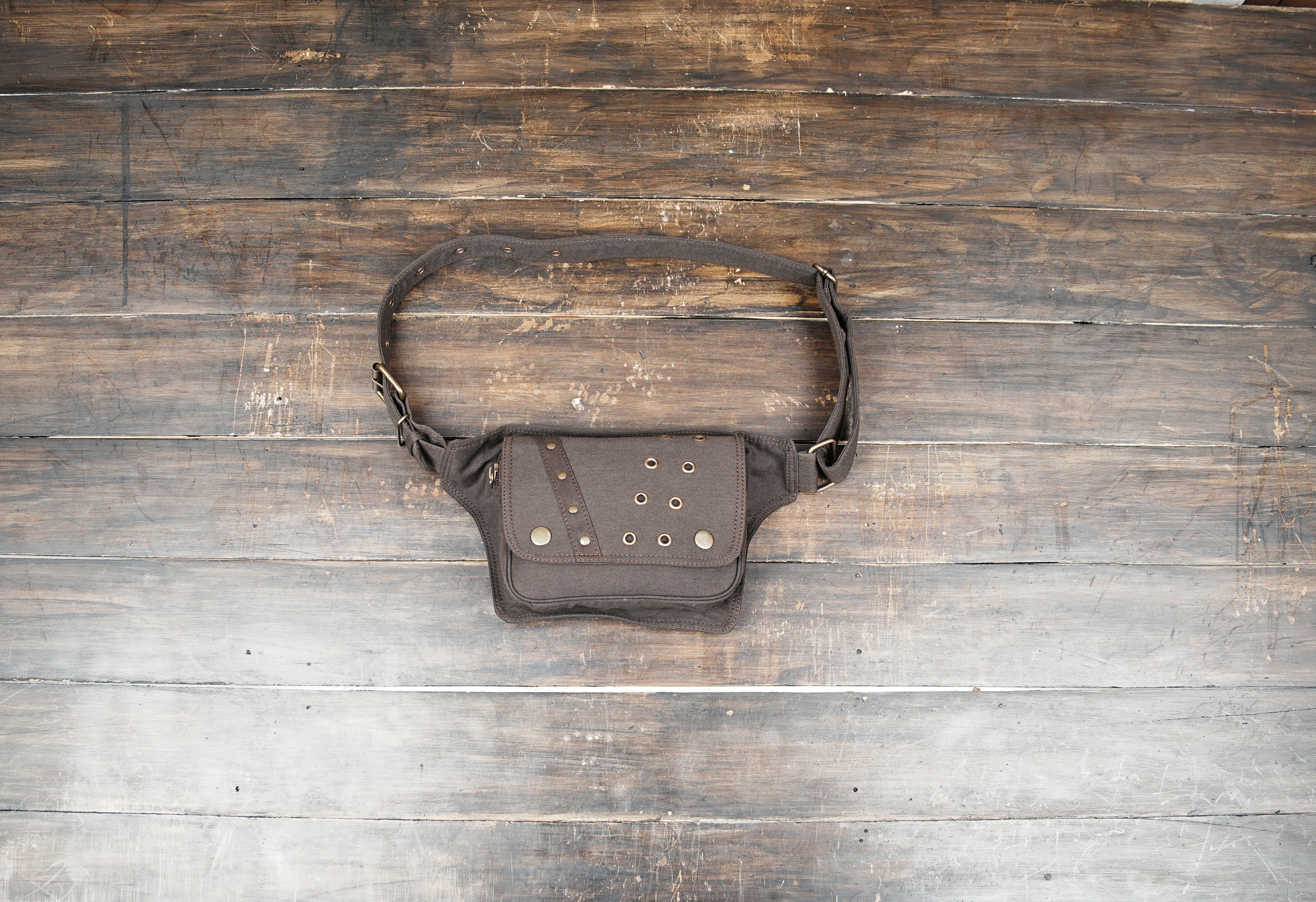 Black cotton waist belt bag with utility pocket and adjustable strap for festival wear