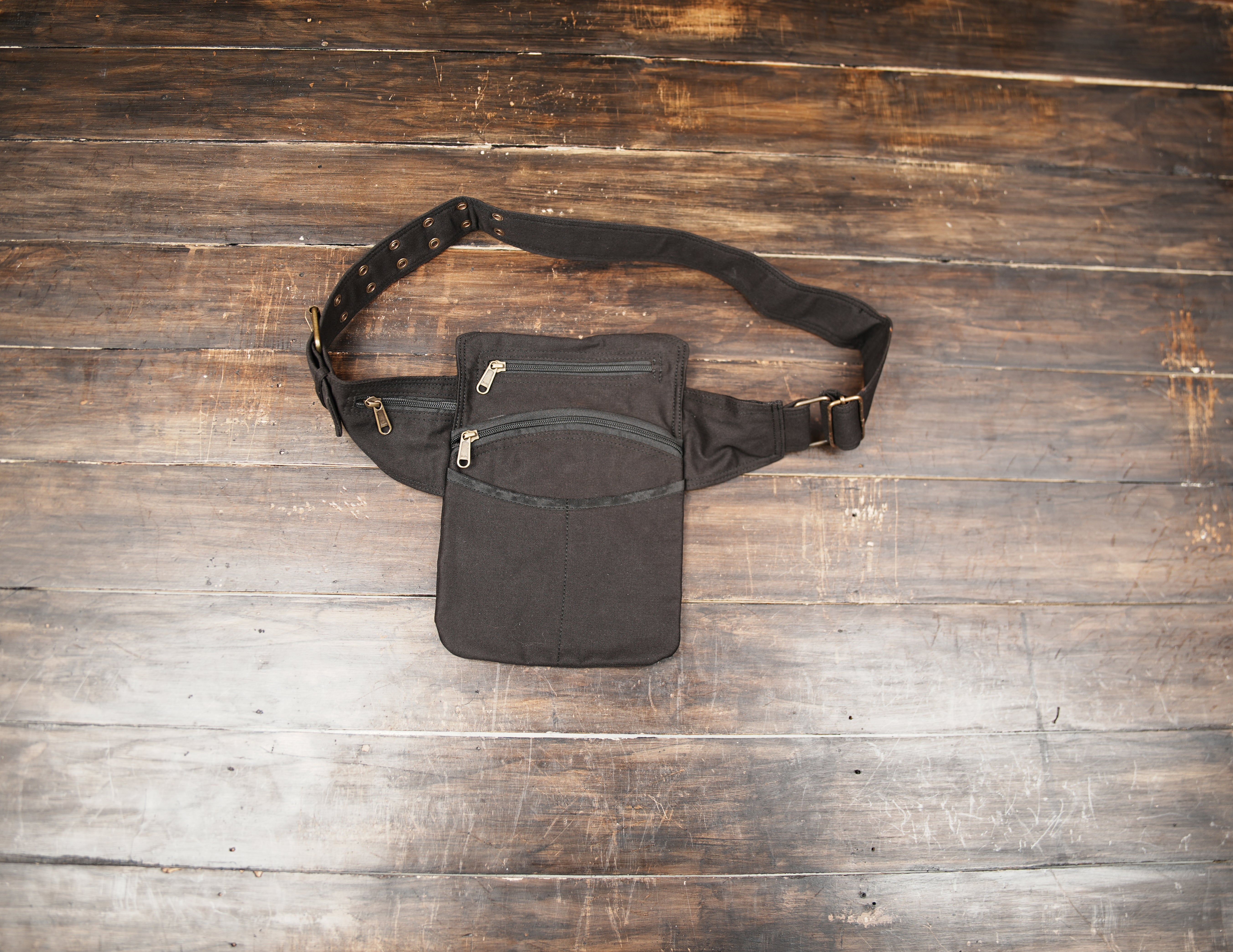 Black cotton utility waist belt bag with multiple zippered pockets