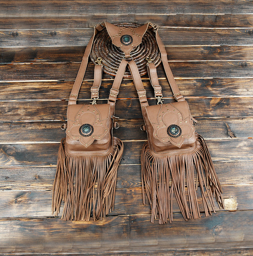 Brown leather dual shoulder holster with fringe and gemstone accents