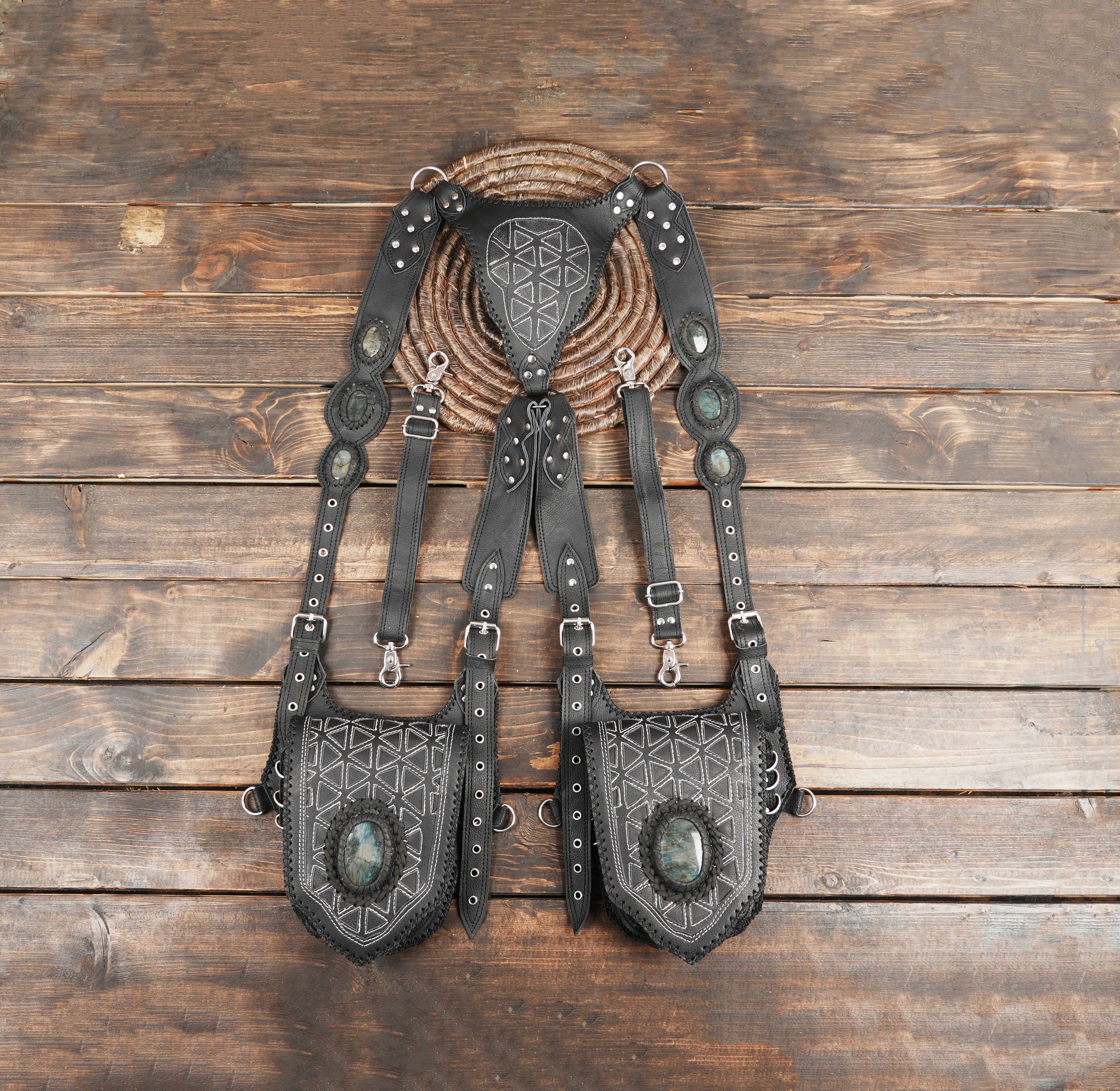 Black double-pouch leather shoulder holster with gemstone accents and geometric stitching