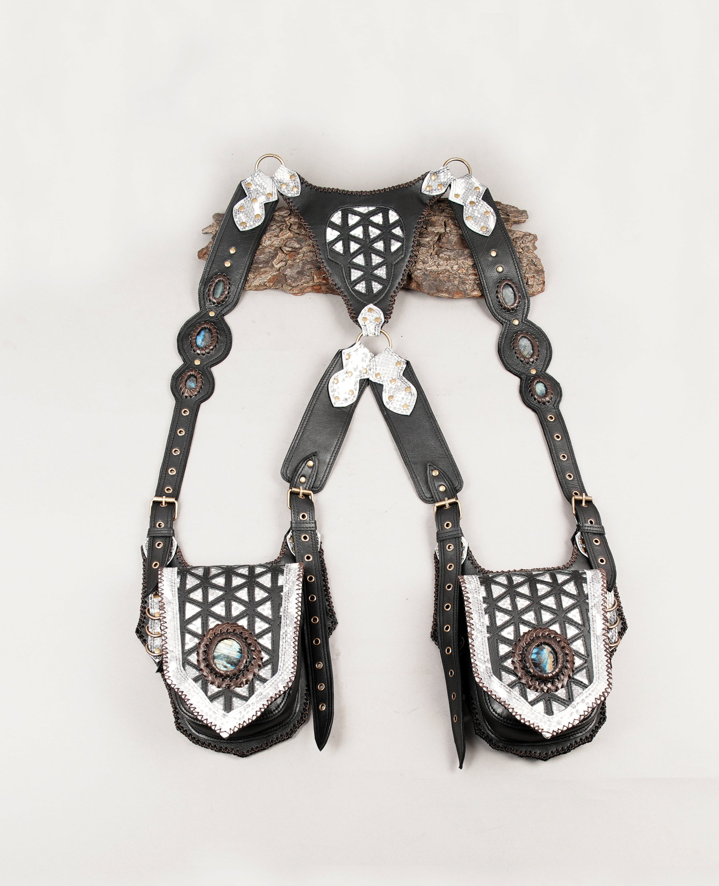 Handcrafted black and silver leather shoulder holster with gemstone accents