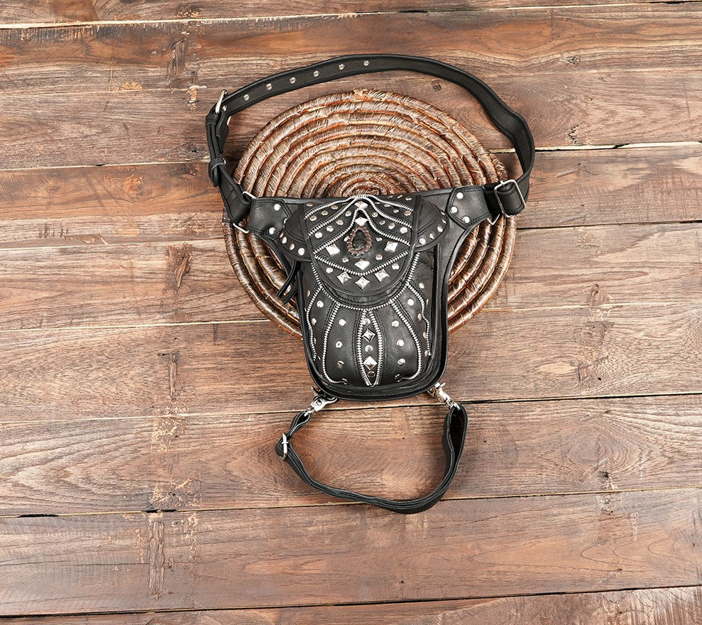 Black leather leg bag with metal studs and handcrafted Western pattern