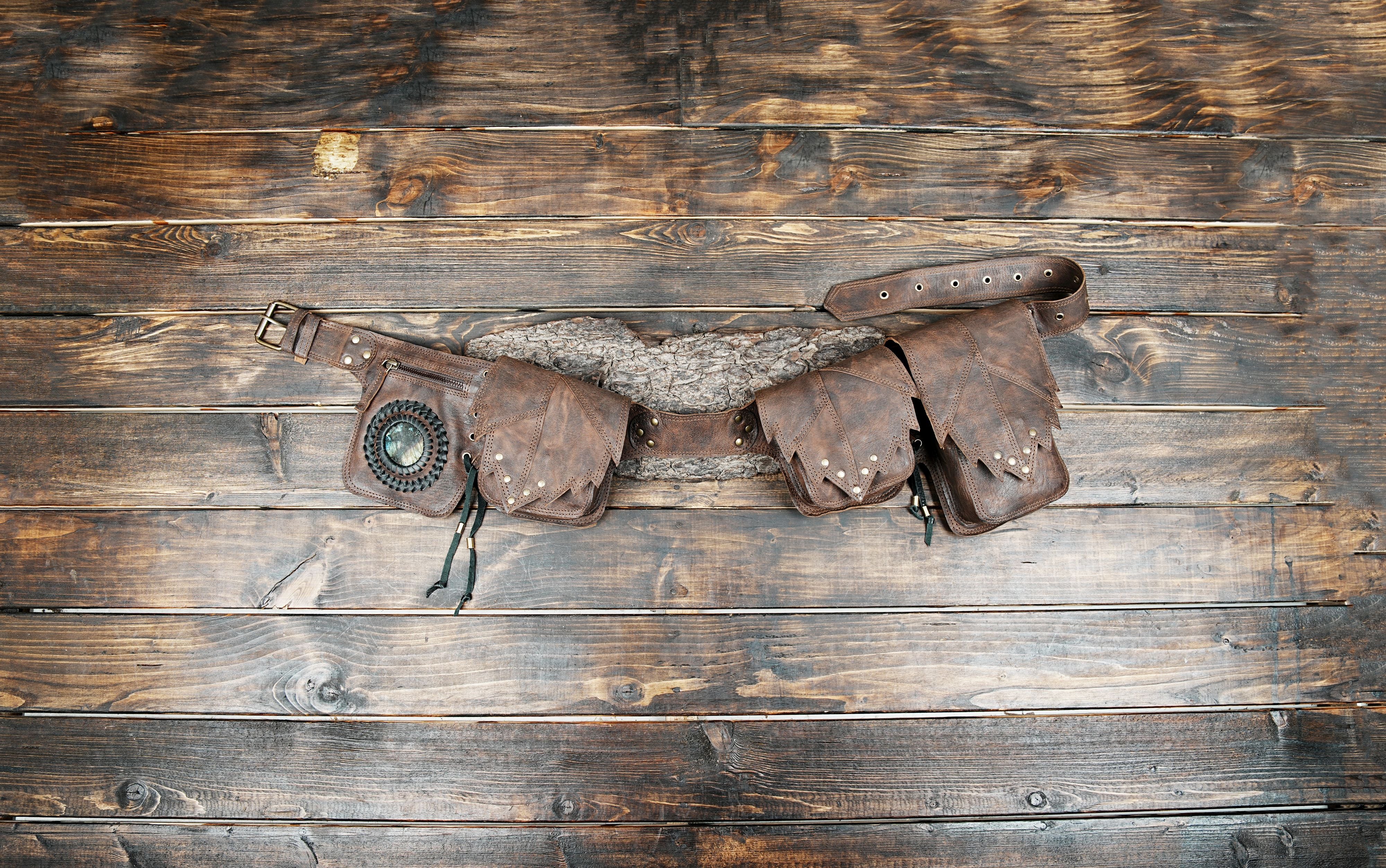Handmade brown leather utility belt with multiple pouches