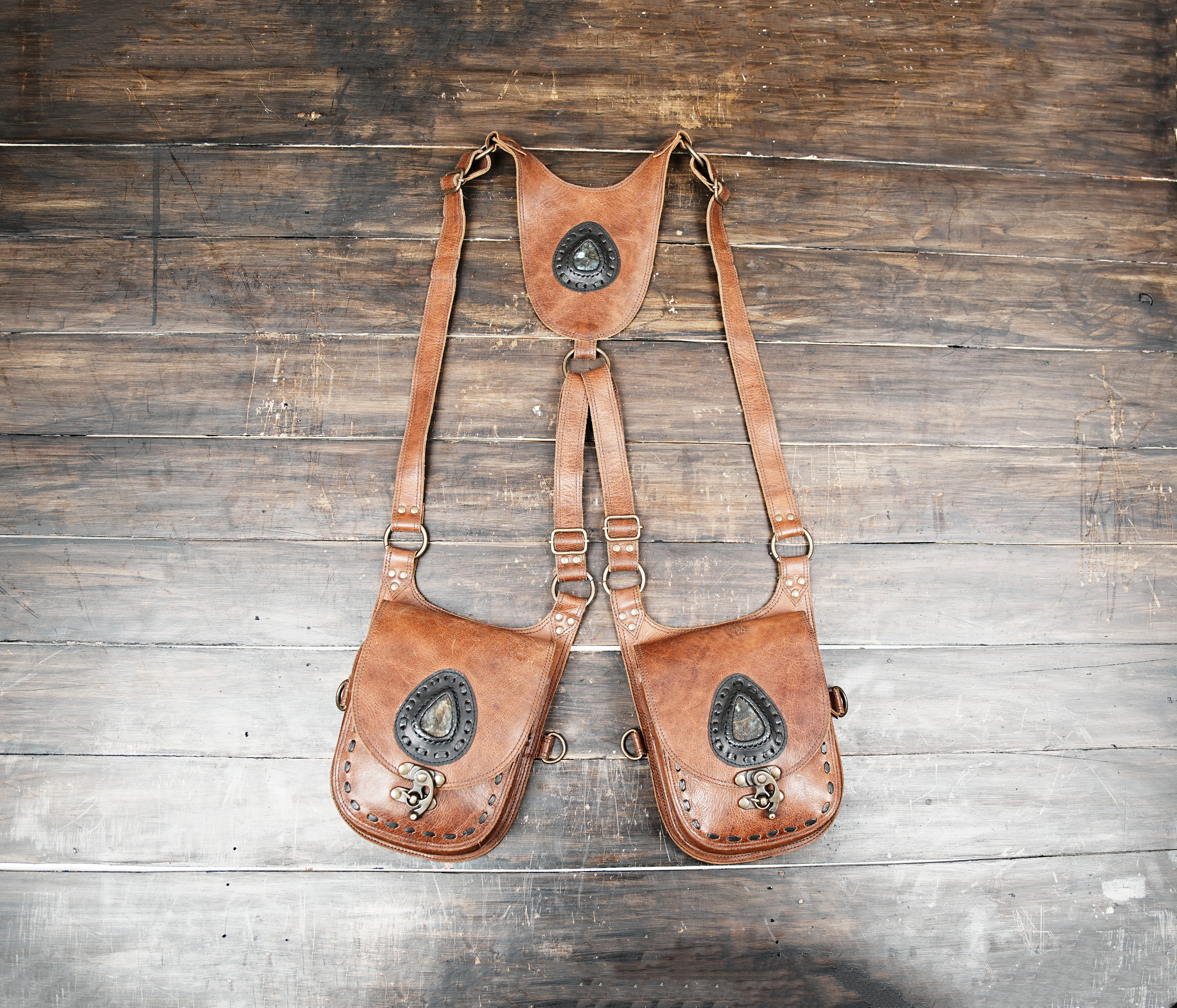 Handcrafted brown leather holster bag with gemstone inlay and rustic Western design