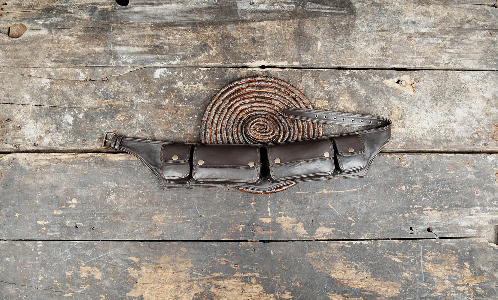 Made from high-quality genuine leather, it features five spacious pouches, providing excellent storage for essentials like phone, wallet, keys, money, or travel gear.