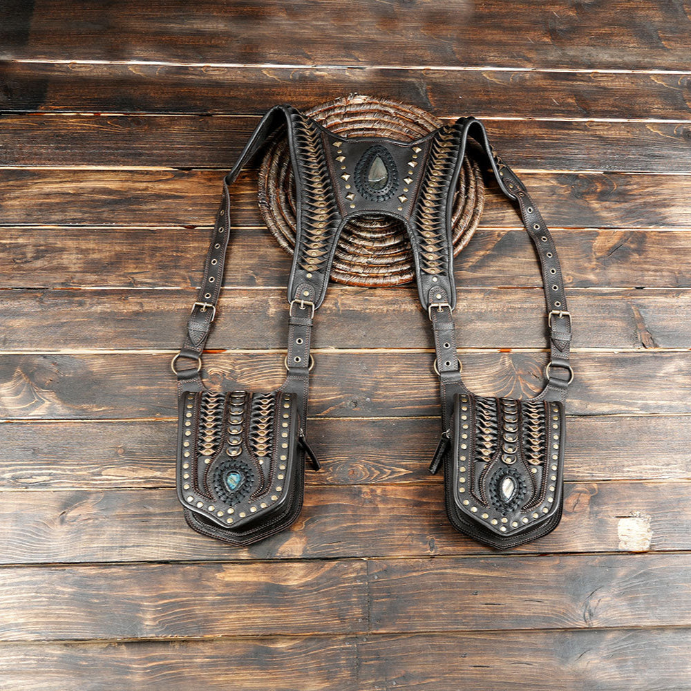 Handcrafted leather utility holster bag with gemstone detail on rustic wooden background