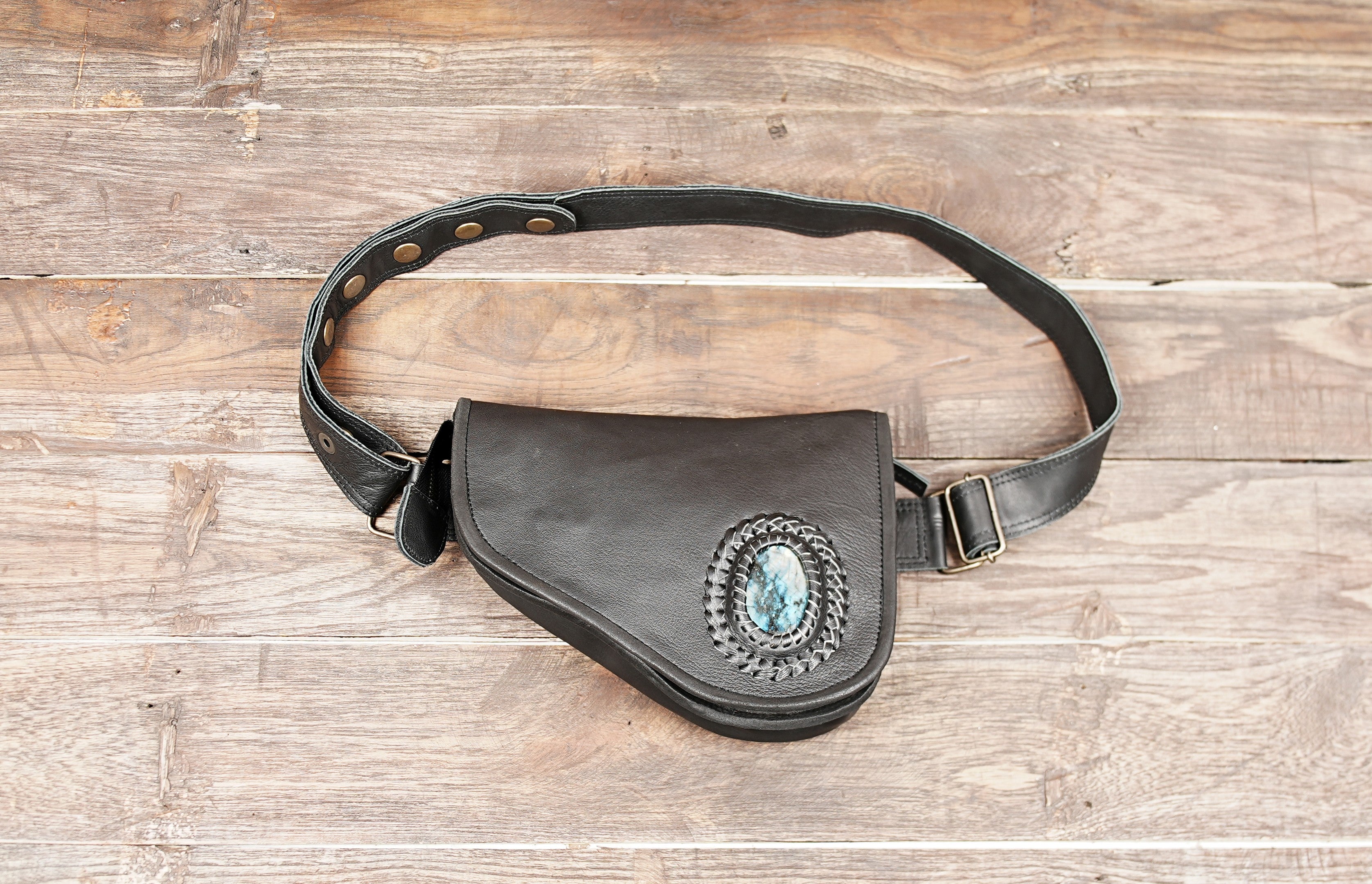 Handmade black leather waist bag with gemstone front view