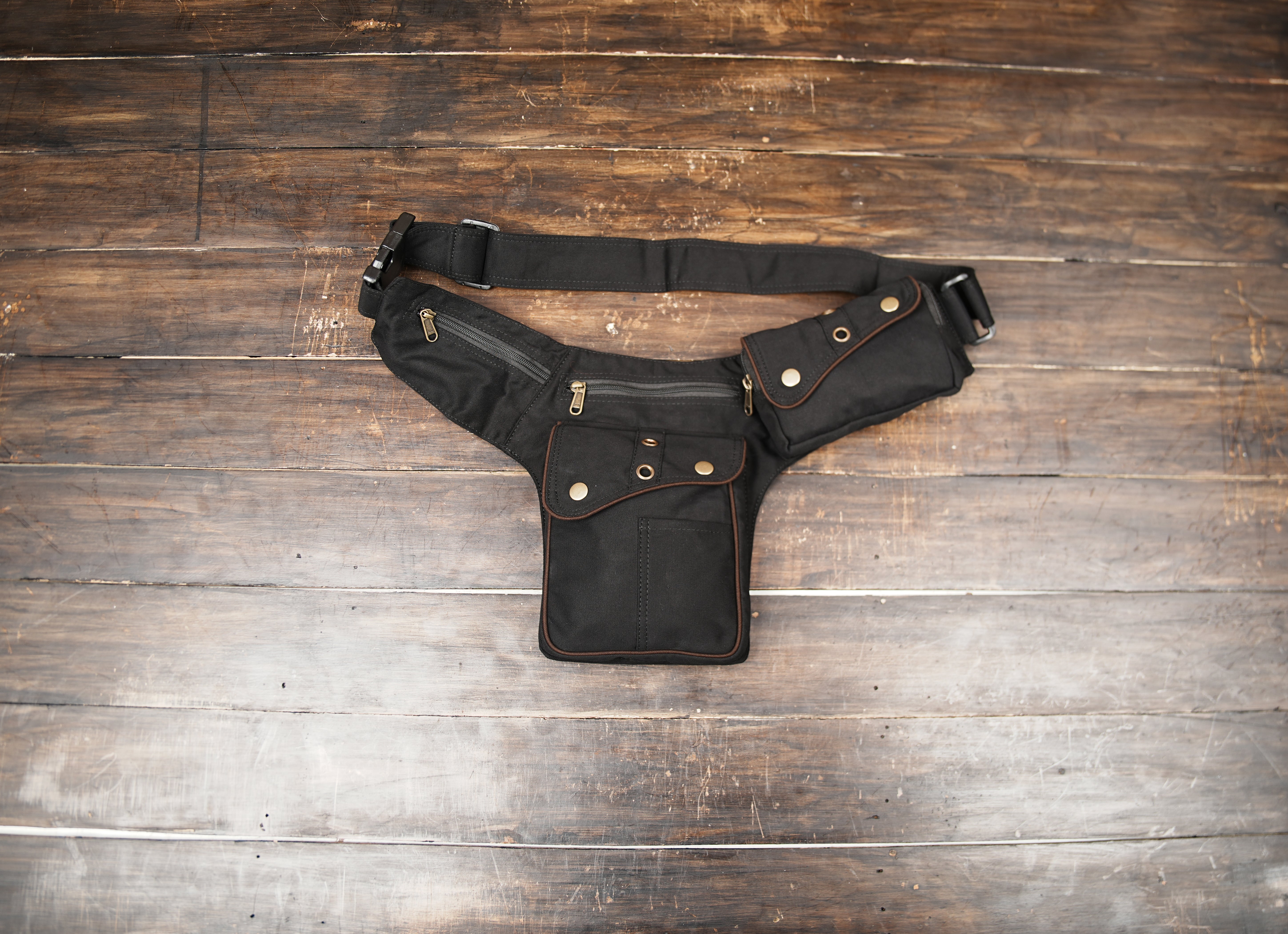 Black cotton utility waist belt bag with multiple zippered pockets