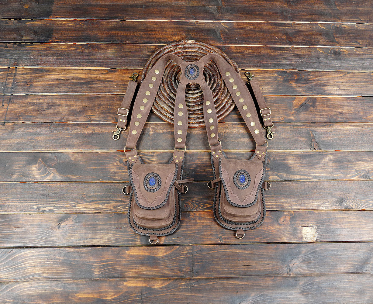 black leather holster bag with gemstone detail and brass rivets