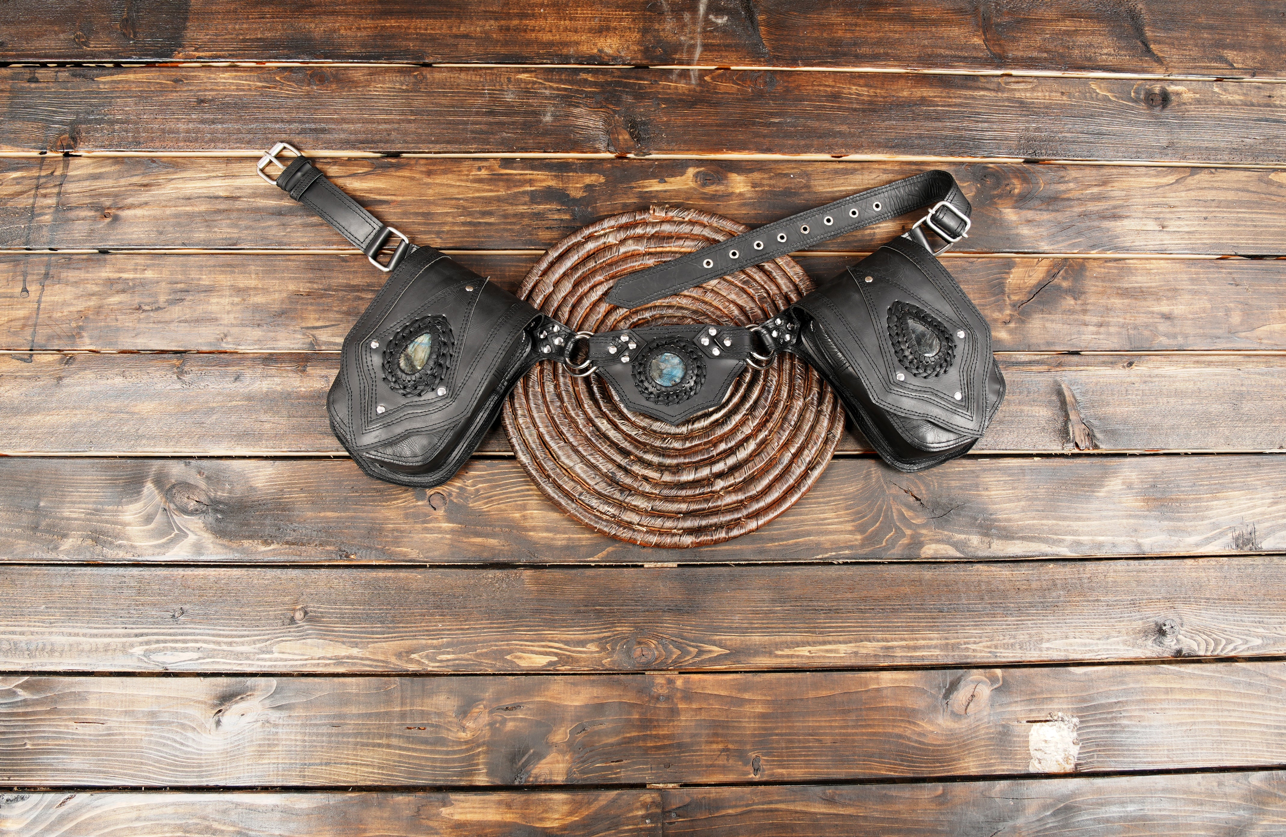 Black leather waist belt with dual pouch design and stone accents