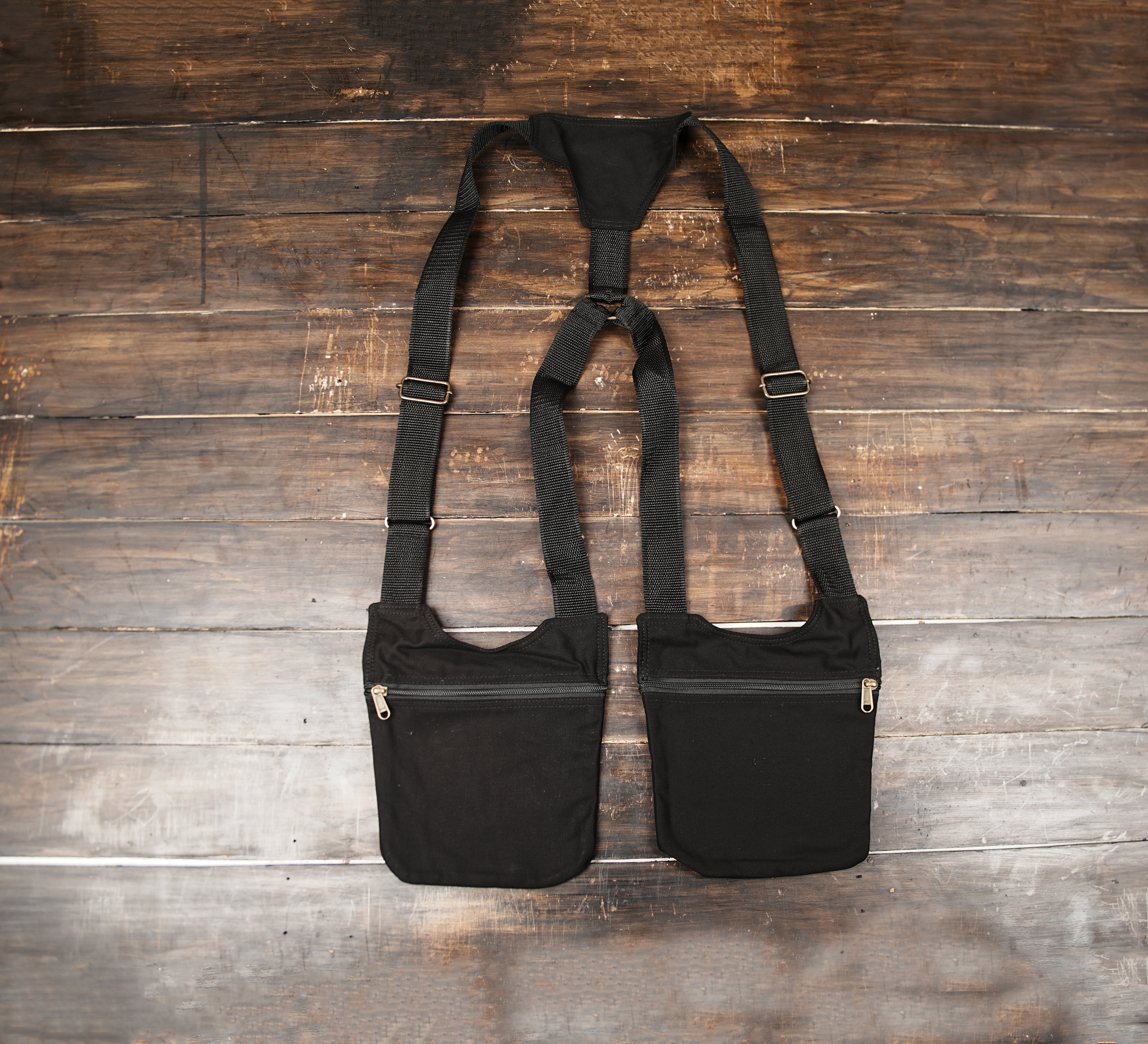 Black cotton utility chest harness bag with dual zipper pockets
