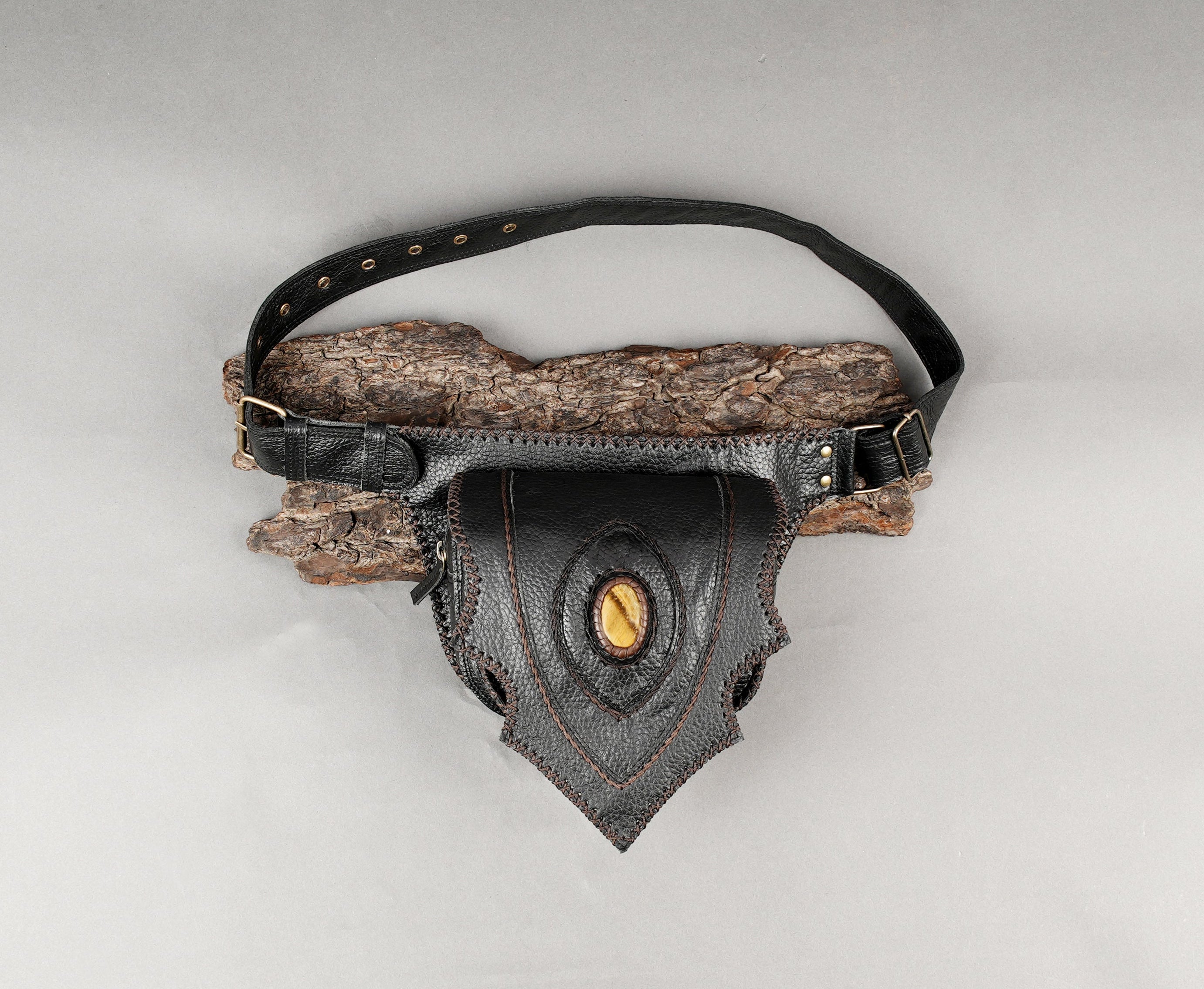 Black handcrafted leather waist belt with central gemstone accent