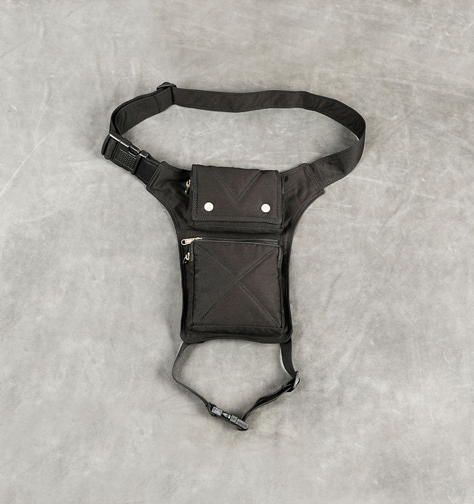 Black canvas thigh holster bag with waist belt and zipper pocket