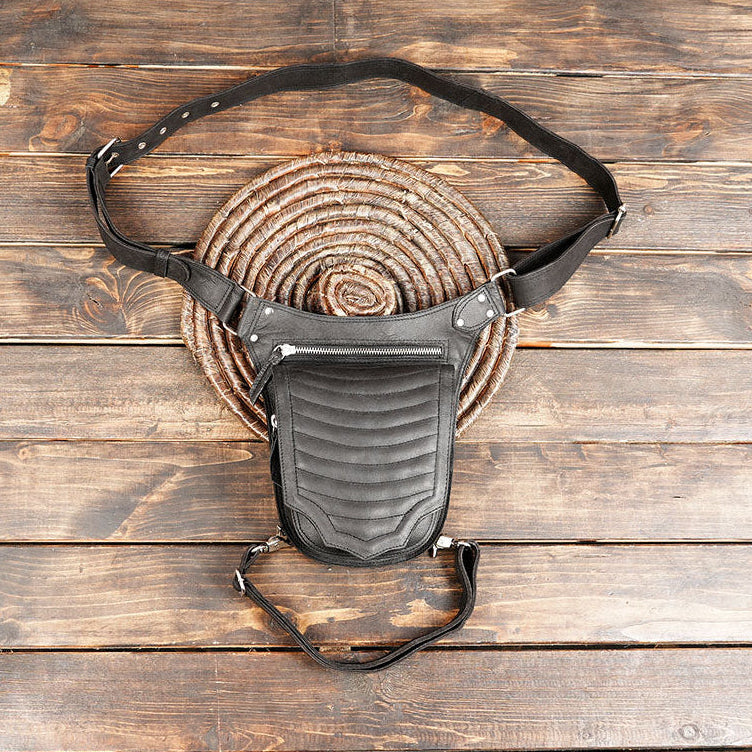 Handmade black leather waist and thigh belt with zipper pocket.