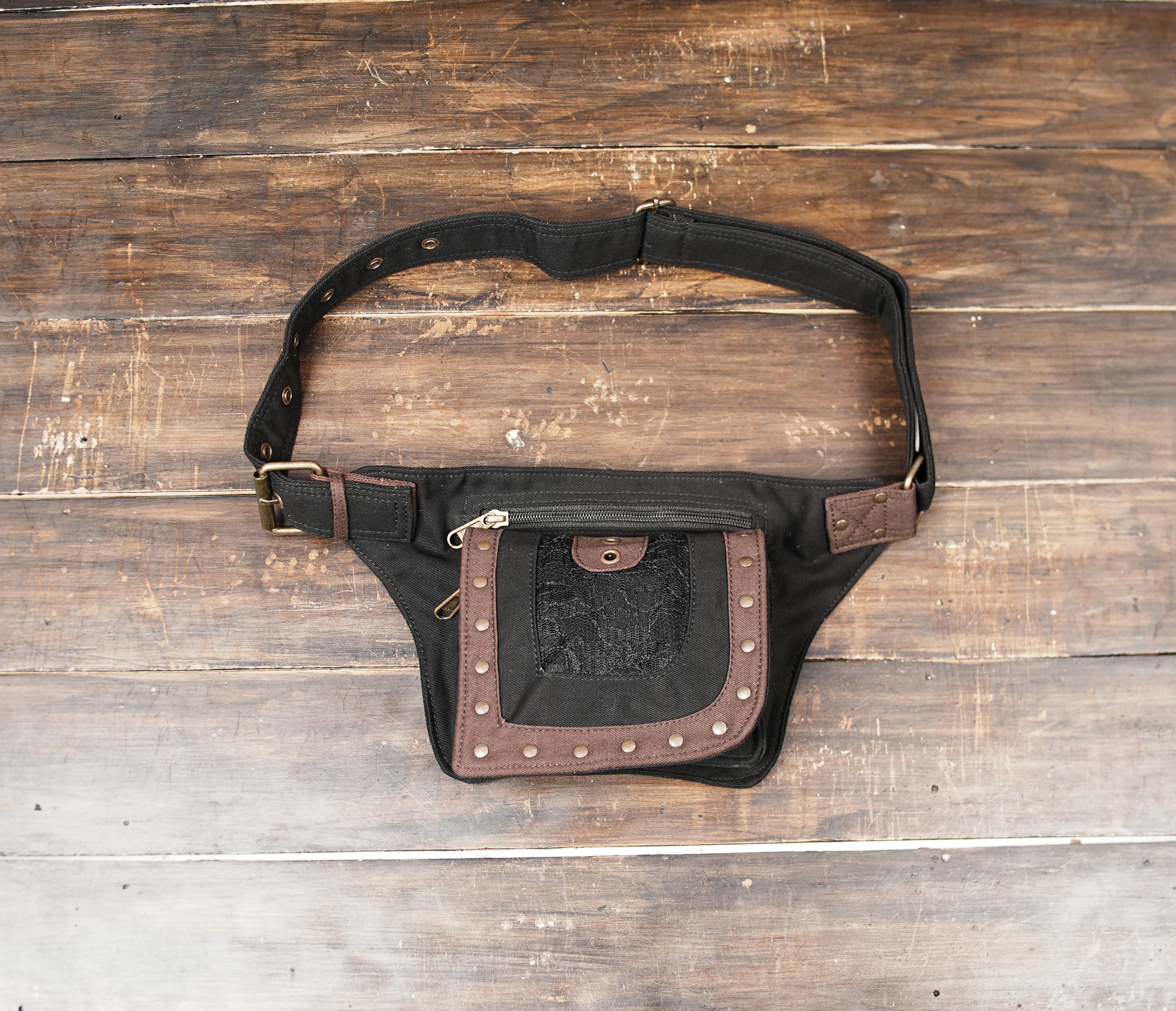 Black and brown canvas hip bag with metal studs