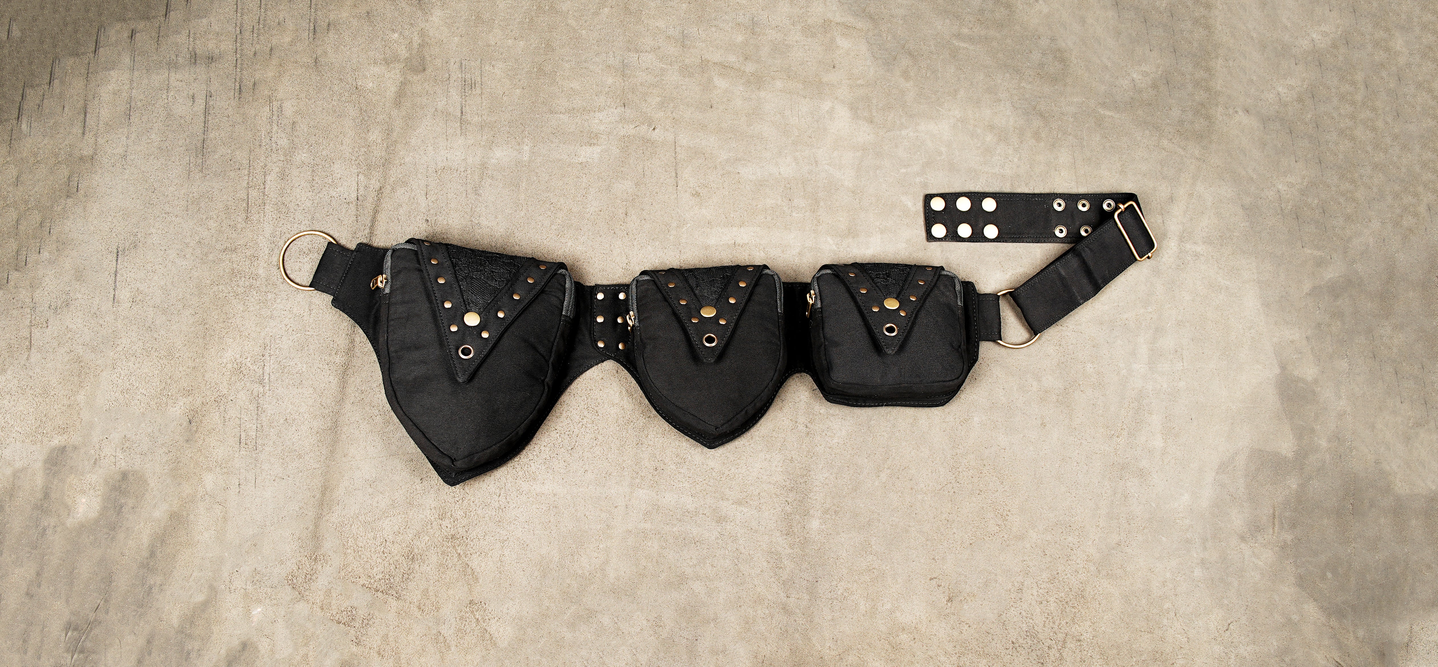 Black cotton utility waist belt with multiple pockets and brass studs