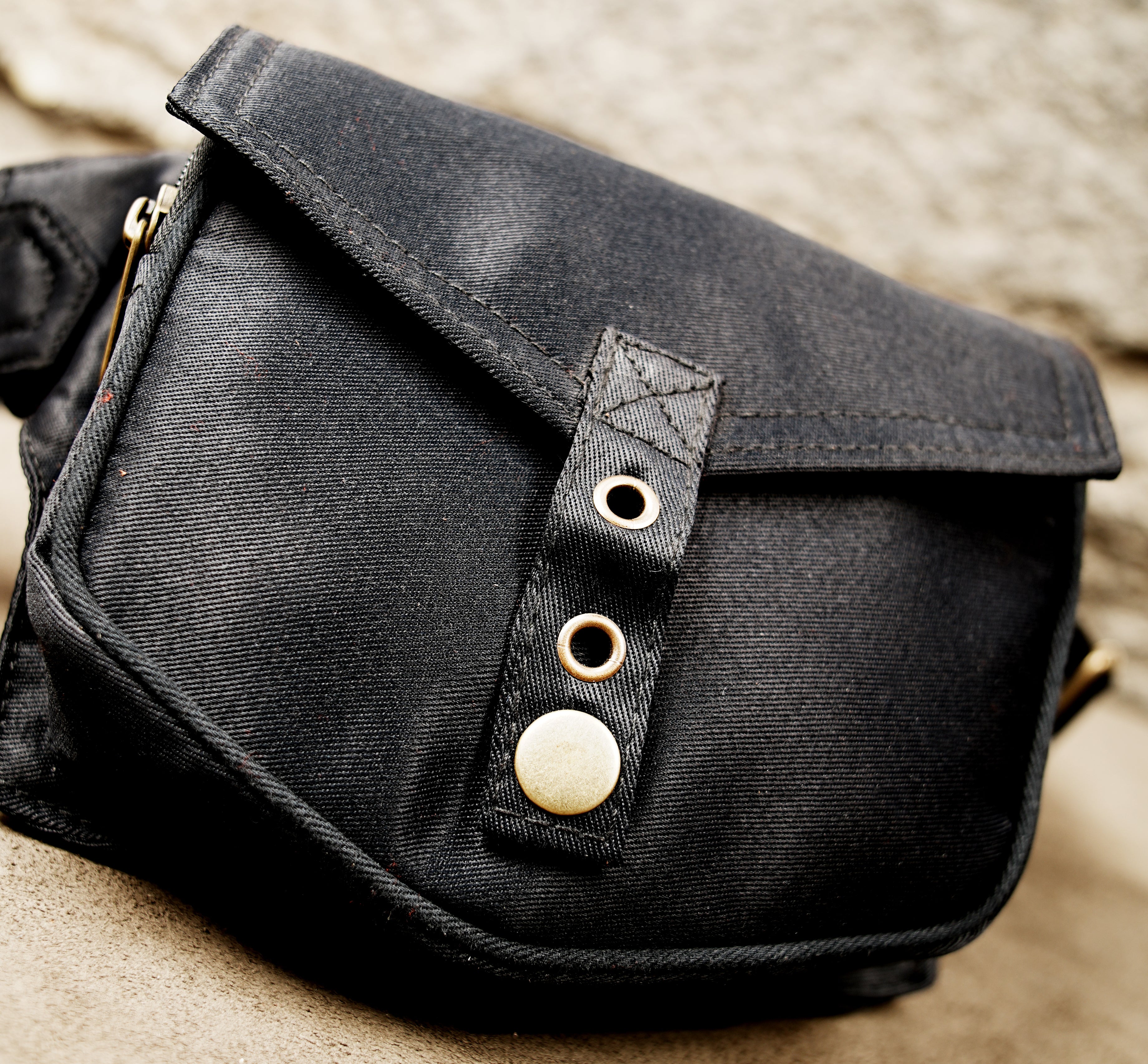 Unisex black canvas fanny pack with antique brass hardware