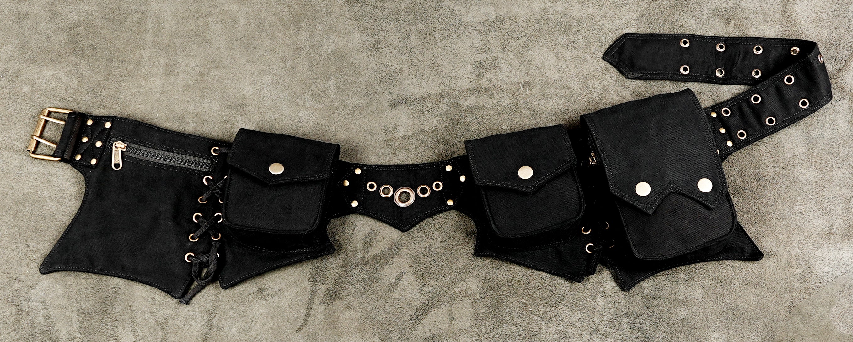 Black festival utility belt with multiple storage pouches and silver-tone details