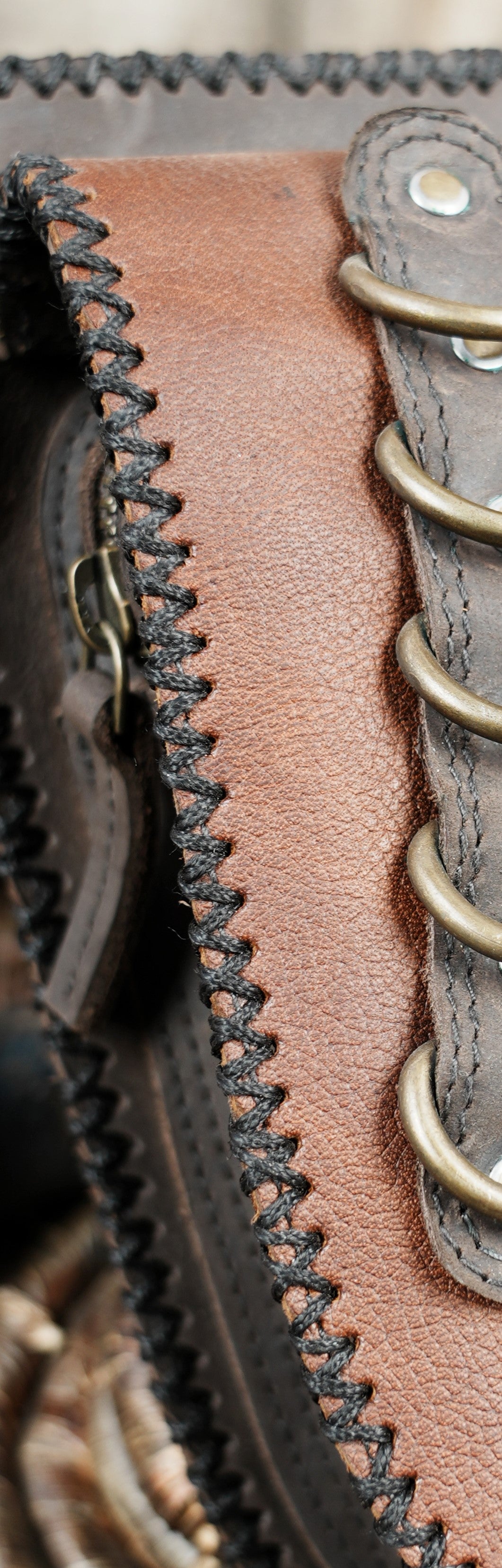 Medieval inspired leather belt bag with metal ring detail and stitching