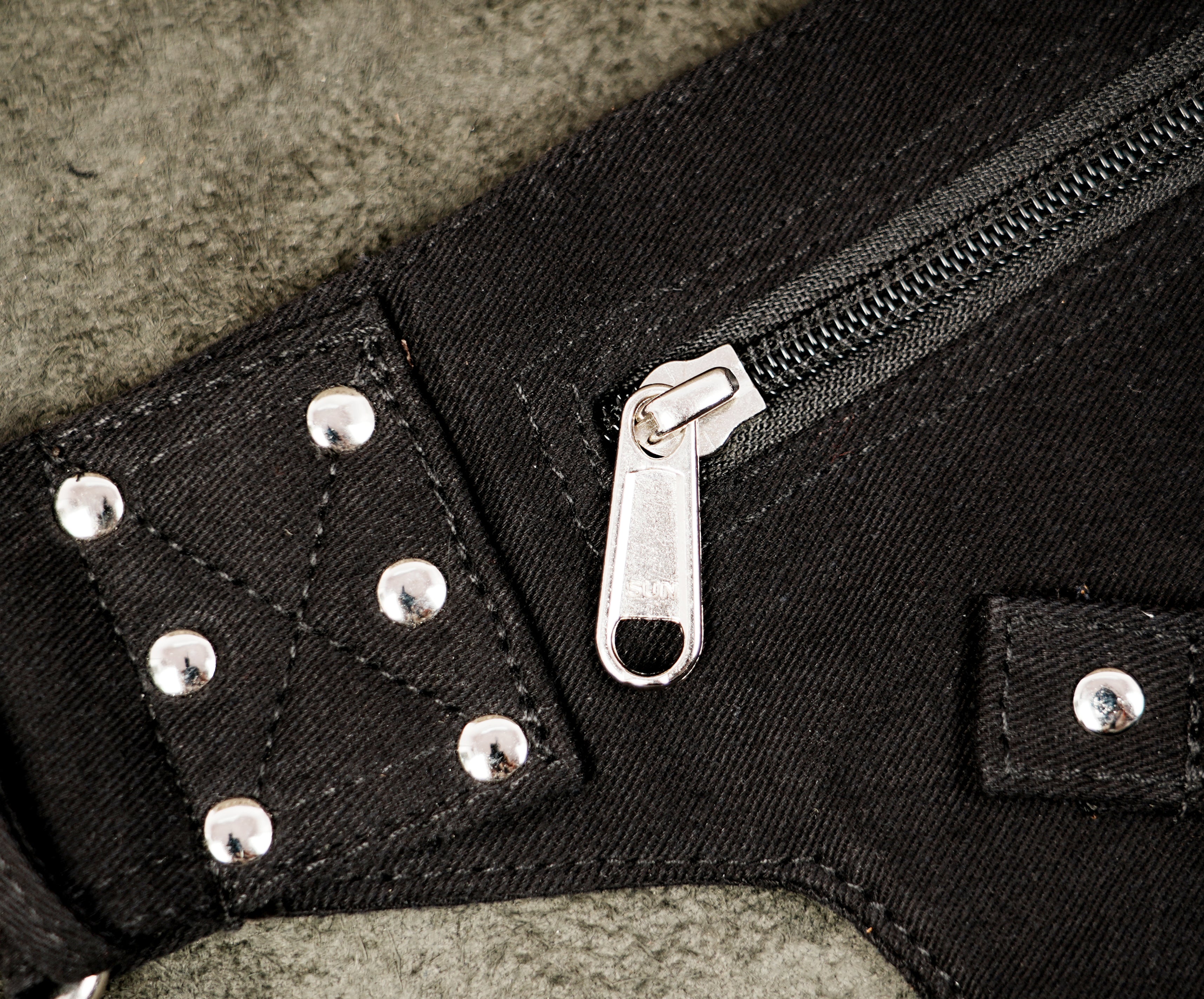 Black cotton holster-style hip belt with lace-up pockets and O-ring