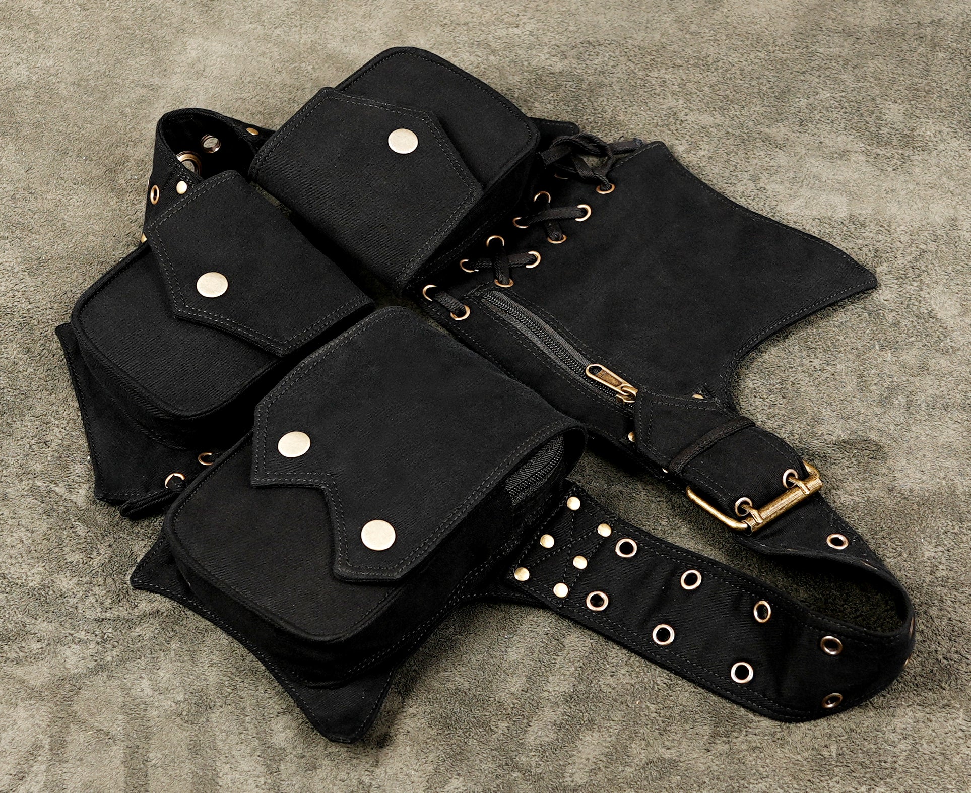 Black cotton waist belt with multiple utility pockets and metal eyelets
